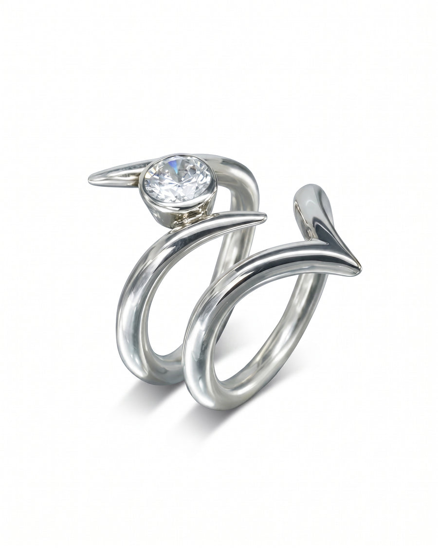 Silver spiky engagement ring with a round diamond.