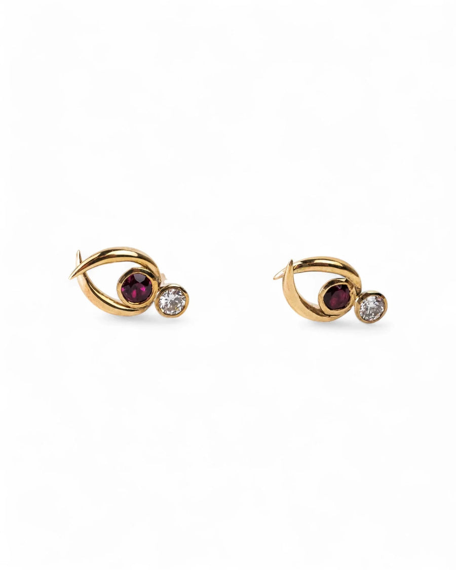 Gold stud earrings with round ruby and diamond on clean white background