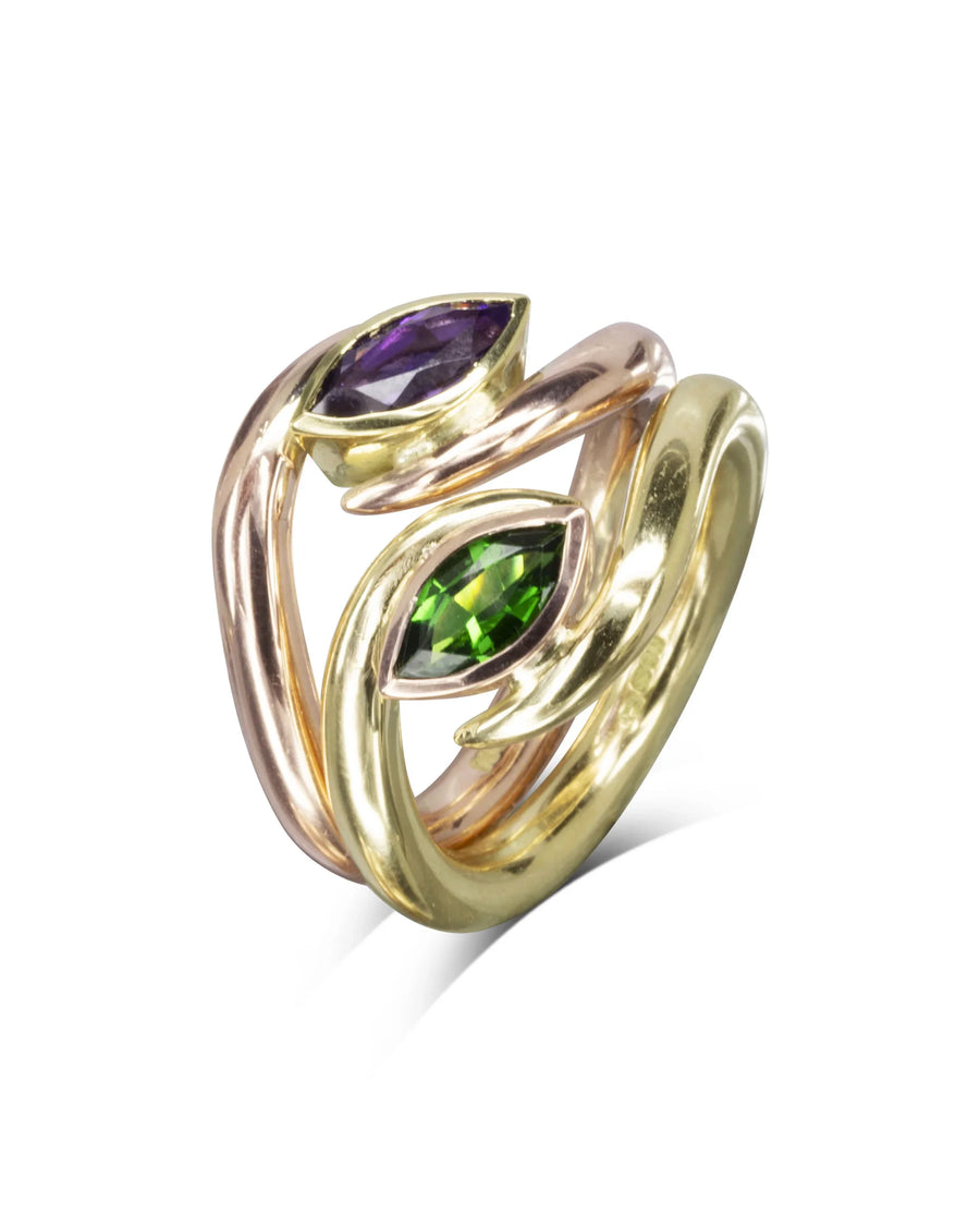 Gold stacking ring set with purple and green marquise gemstones.