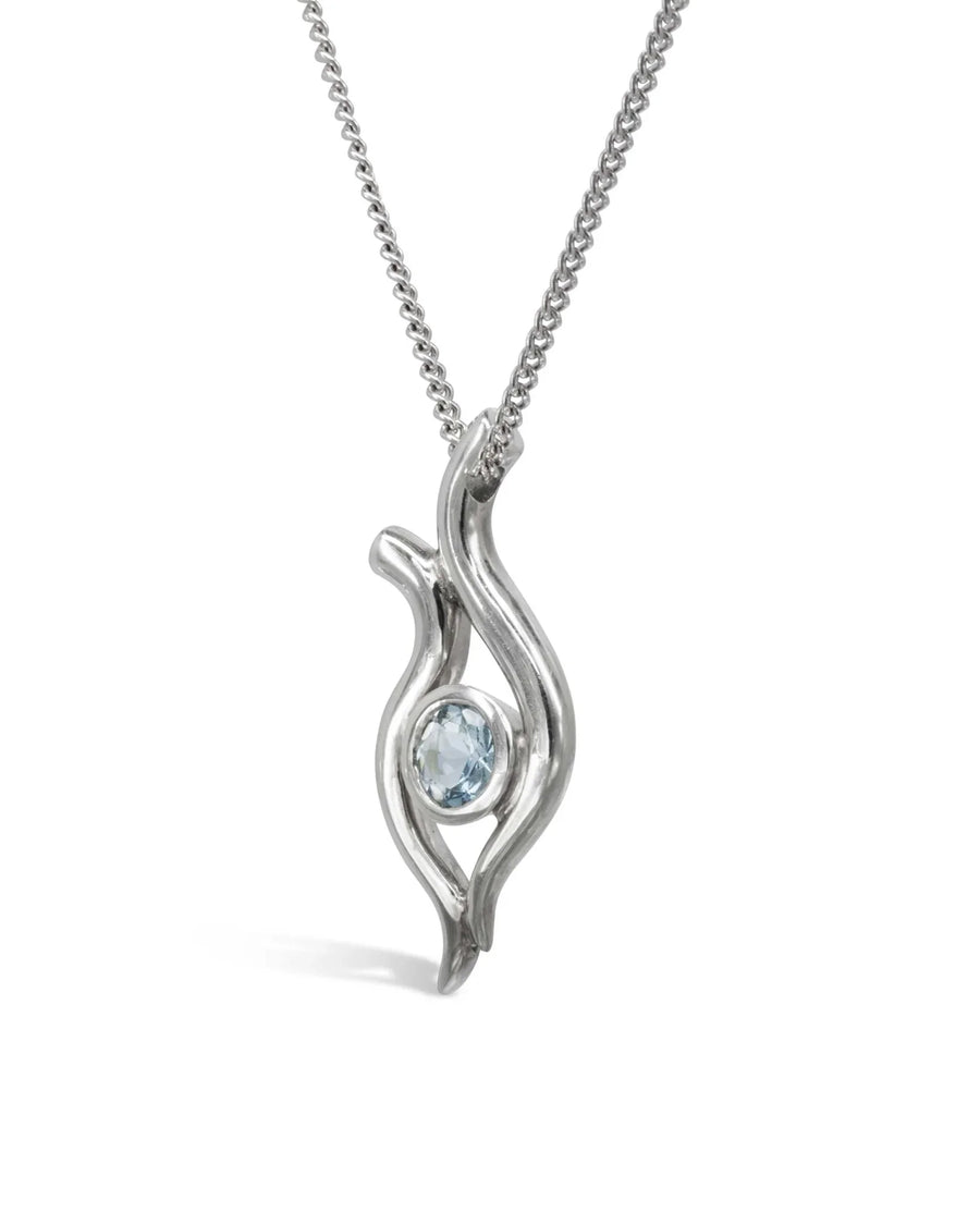 Handmade white gold pendant necklace with organic spiky design and central light blue gemstone