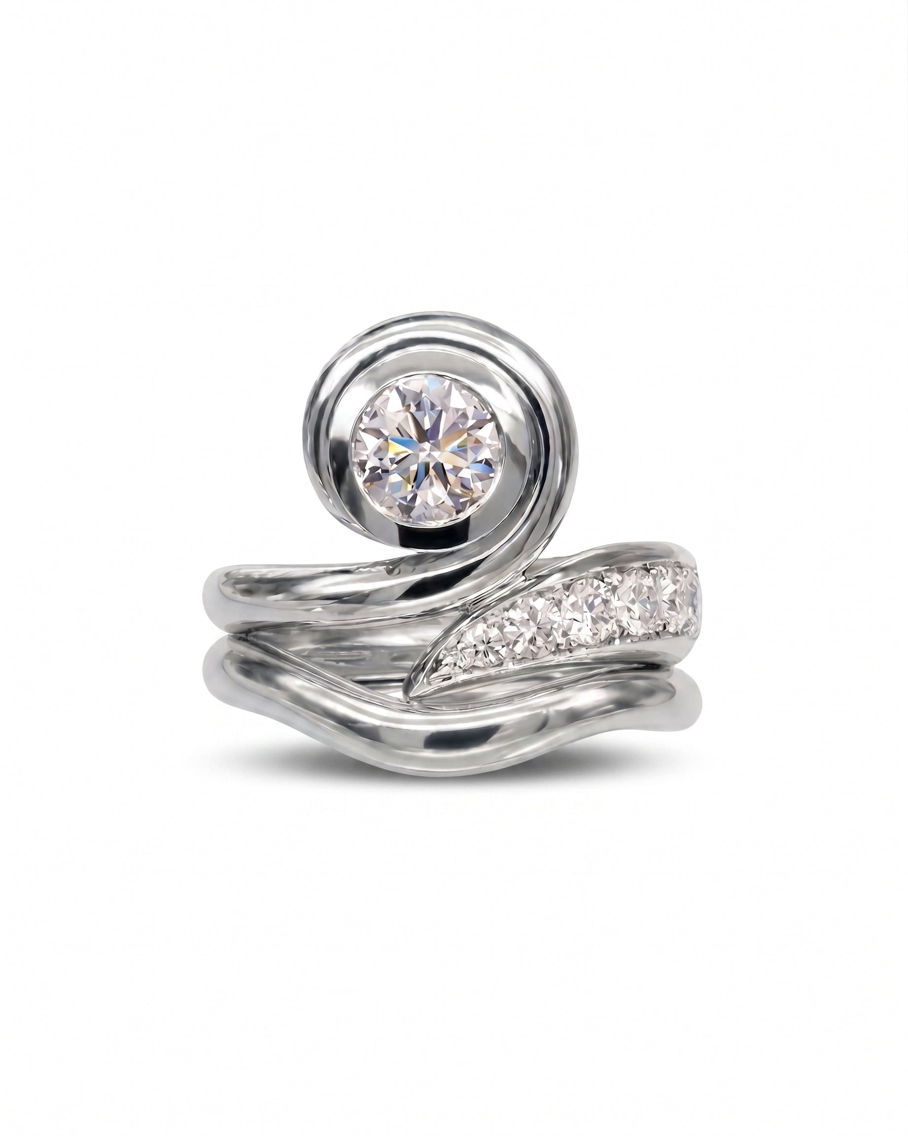 Platinum engagement ring with a round diamond and spiky organic design.