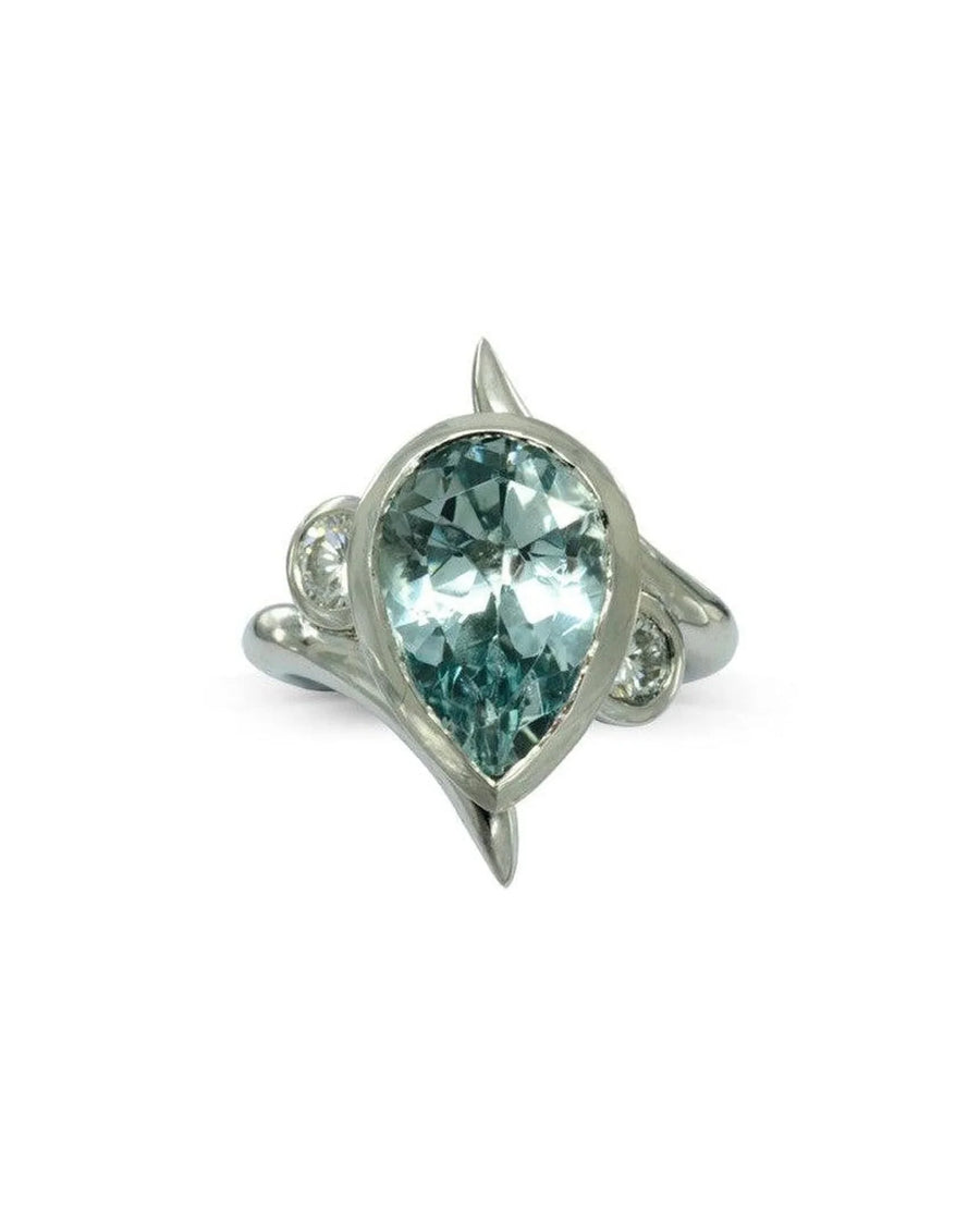 Spiky pear-shaped aquamarine engagement ring with matching silver wedding band