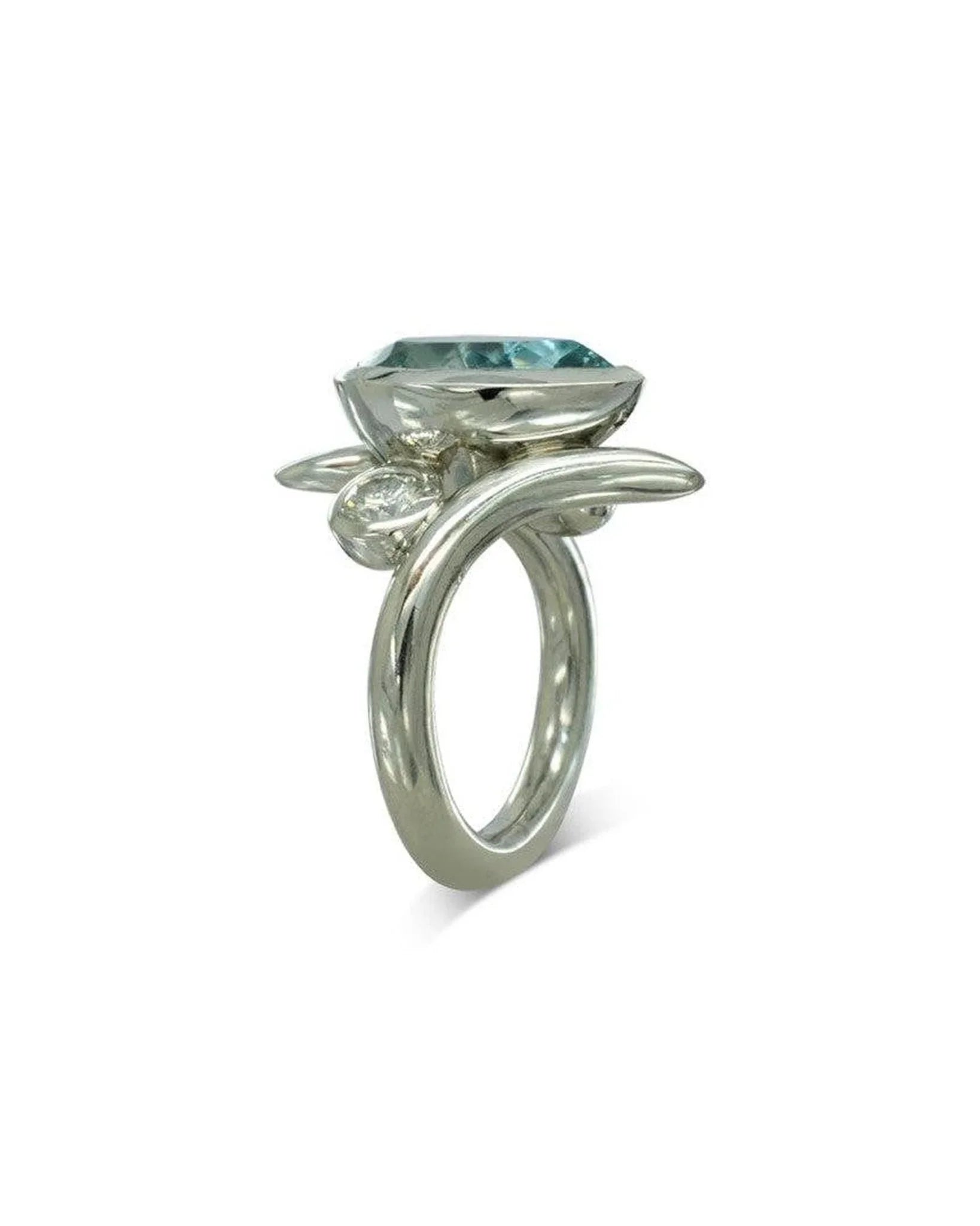 Pear-shaped aquamarine engagement ring with spiky silver details and organic design