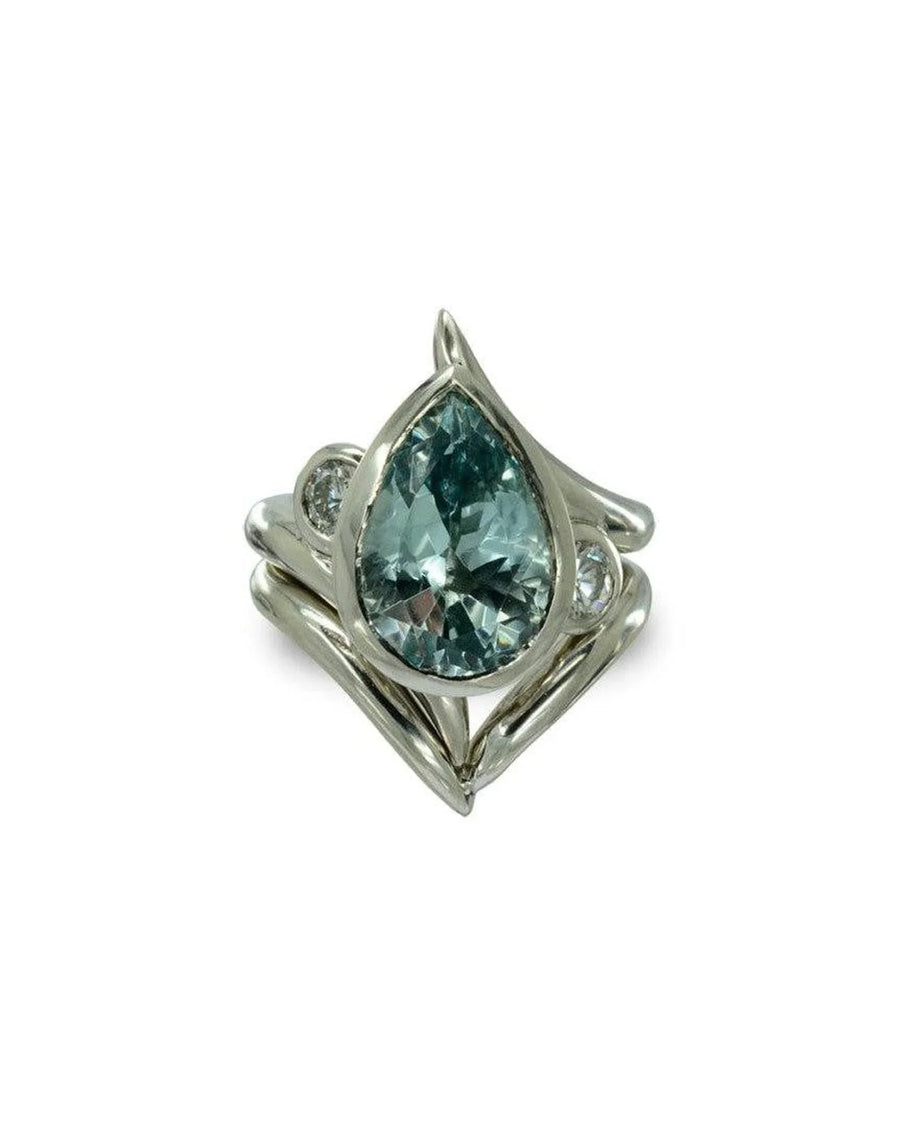 Pear-shaped aquamarine engagement ring with spiky silver band and matching wedding set