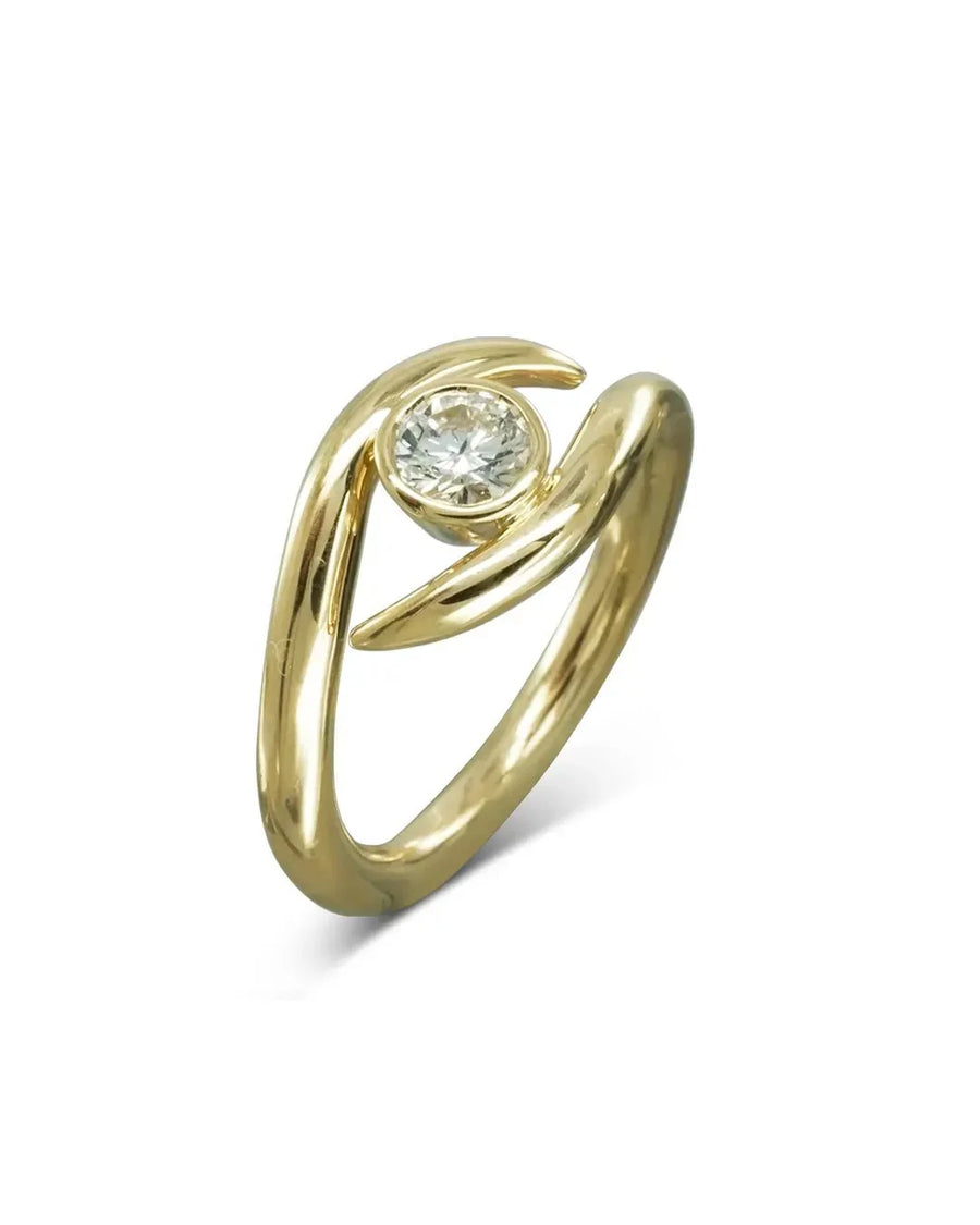 Modern yellow gold ring with organic curves and a round diamond centerpiece
