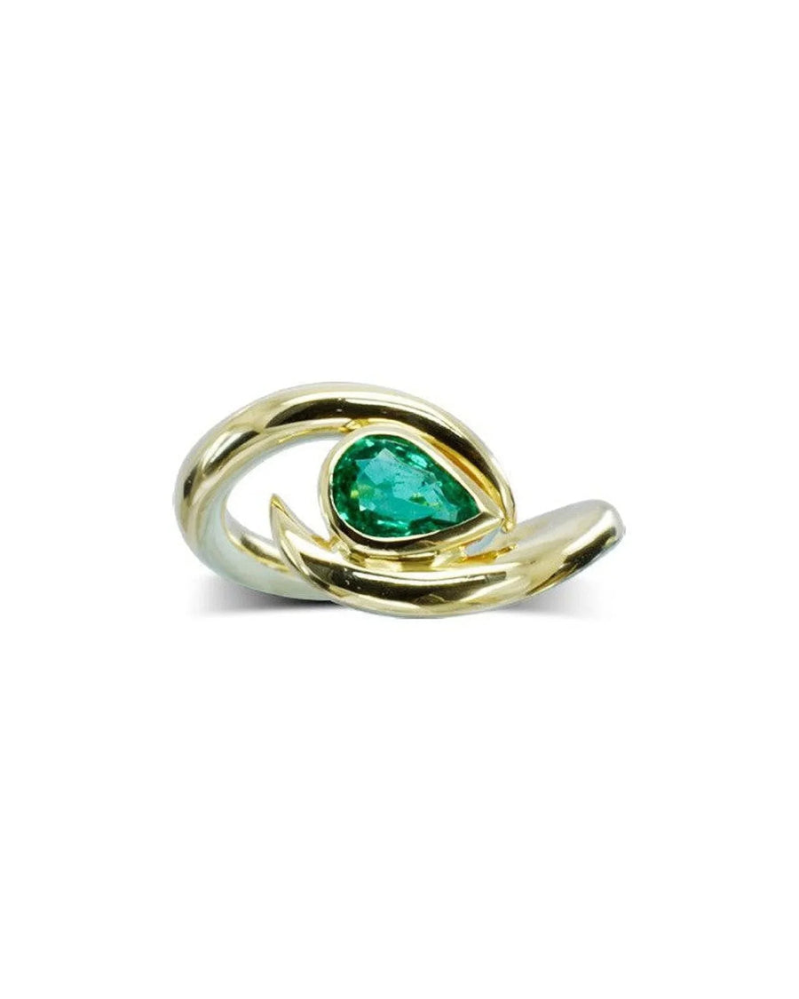 Spiky pear-shaped emerald set in sculpted yellow gold ring on white background