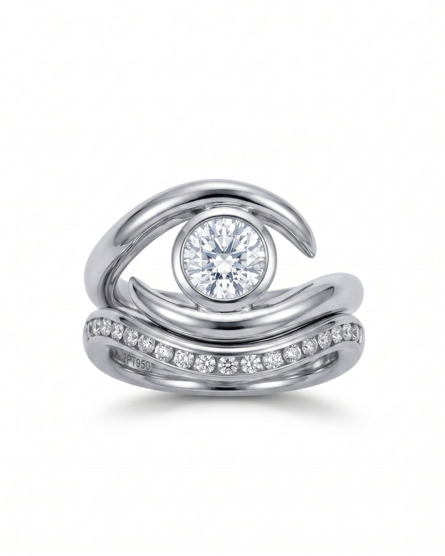Platinum curved fitted ring with a round diamond center and pavé diamonds.