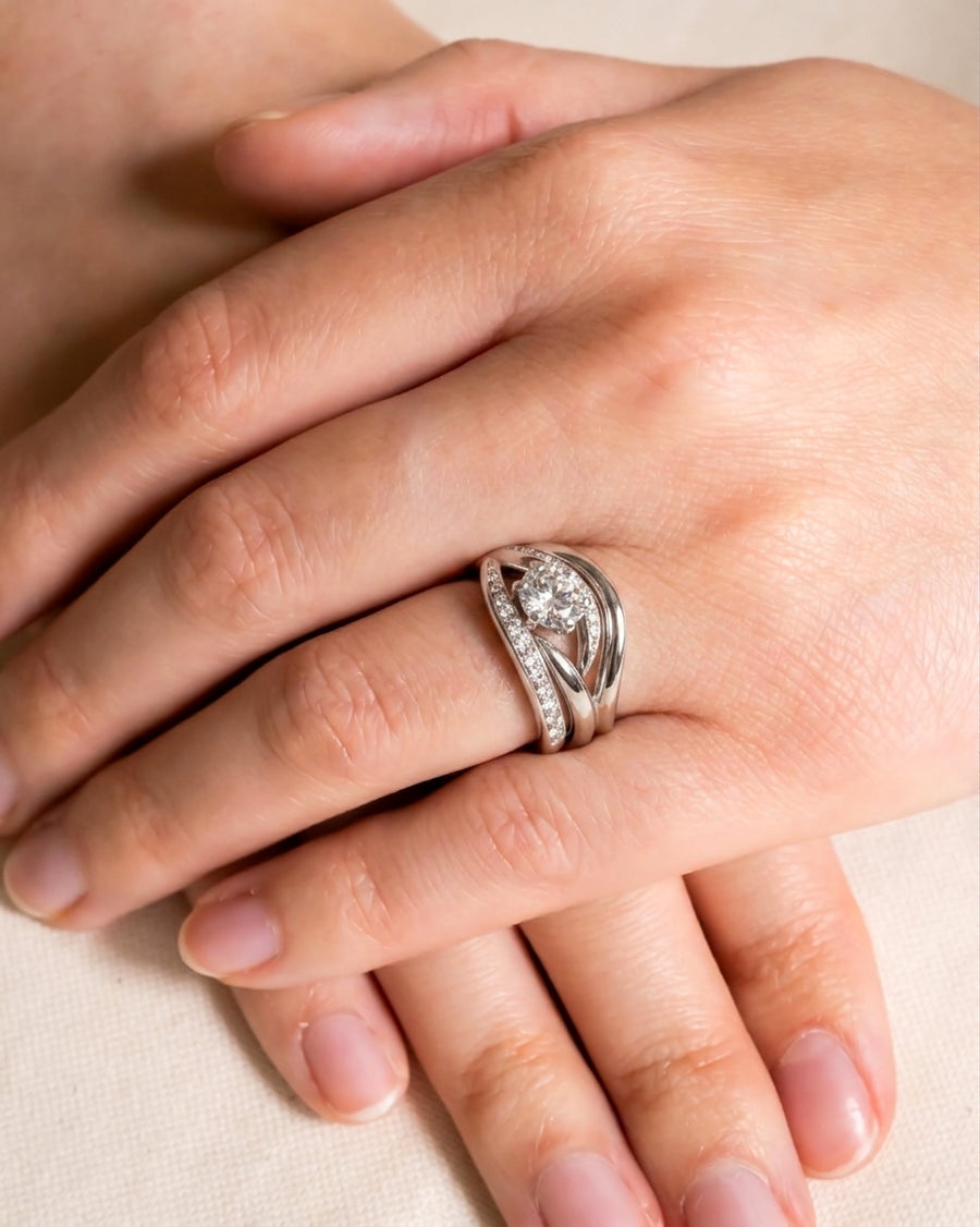 Platinum engagement and wedding band set with a spiky, swirling diamond design.