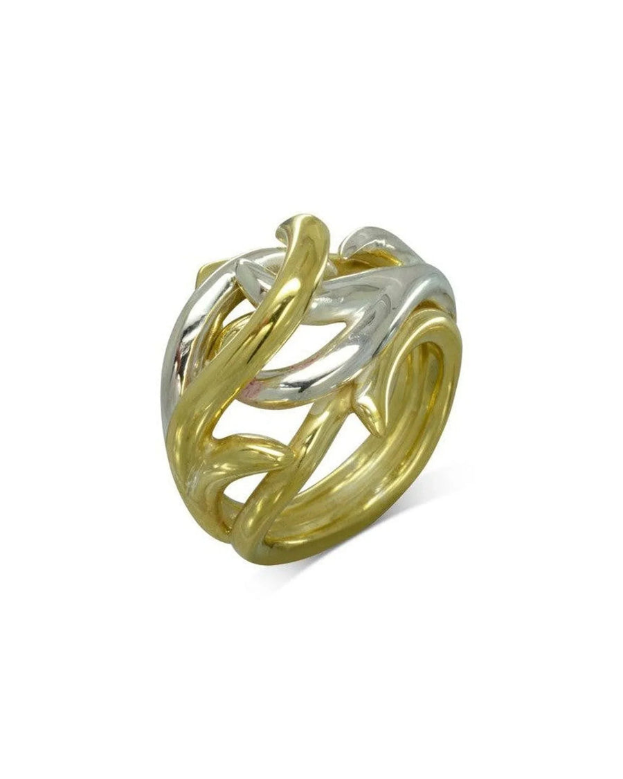 Two-tone gold and silver sculptural ring with organic, intertwined design on white background