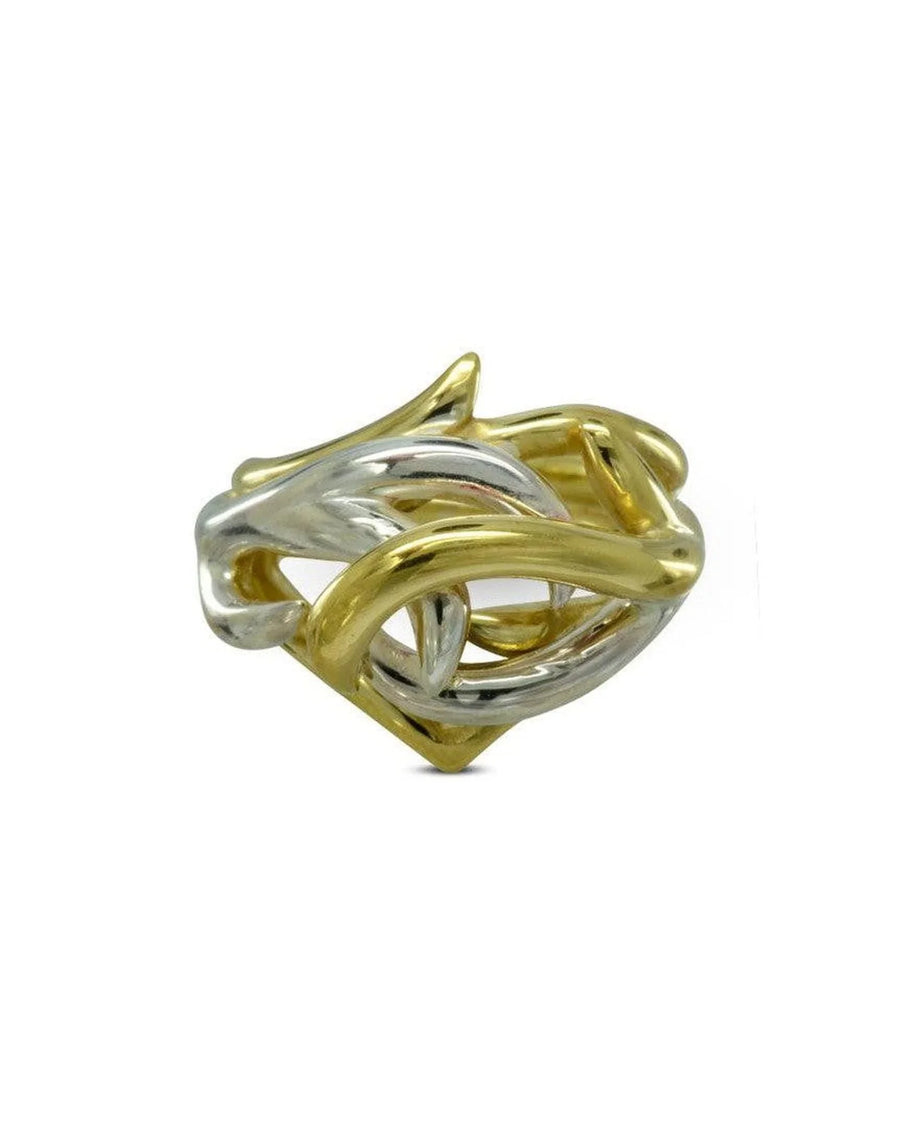 Two-tone gold and silver ring with organic, twisted, spiky design on white background