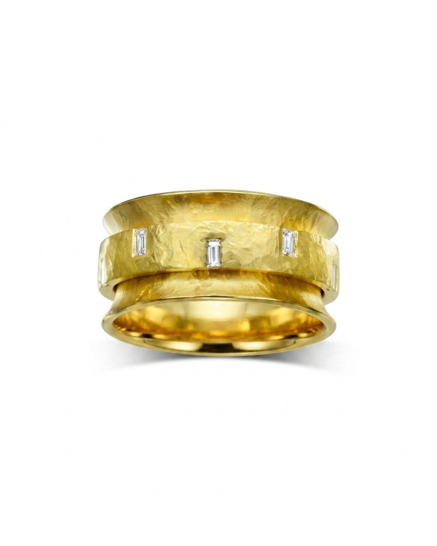 Yellow gold spinning eternity ring with baguette cut diamonds.