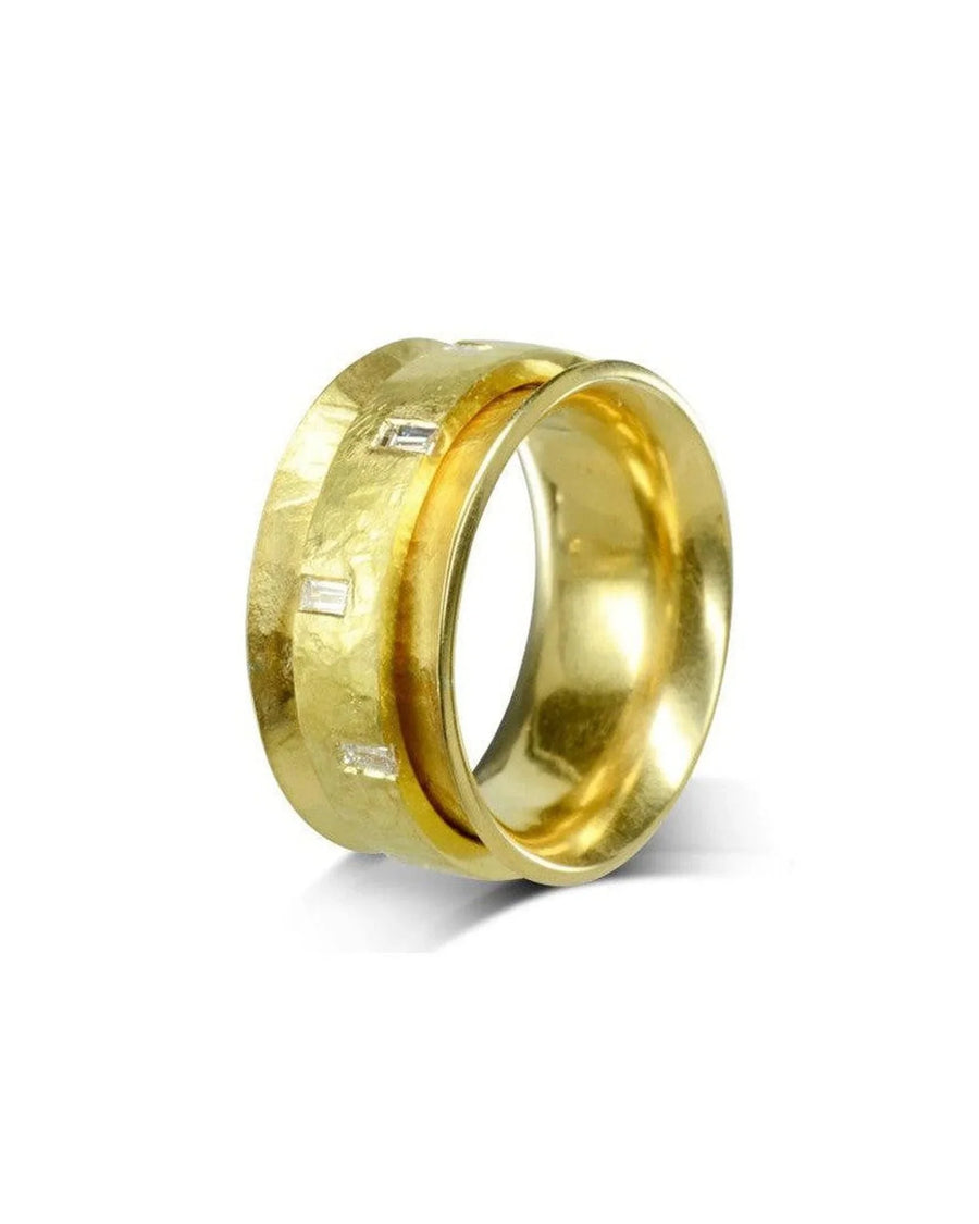 Yellow gold spinning eternity ring with baguette cut diamonds.