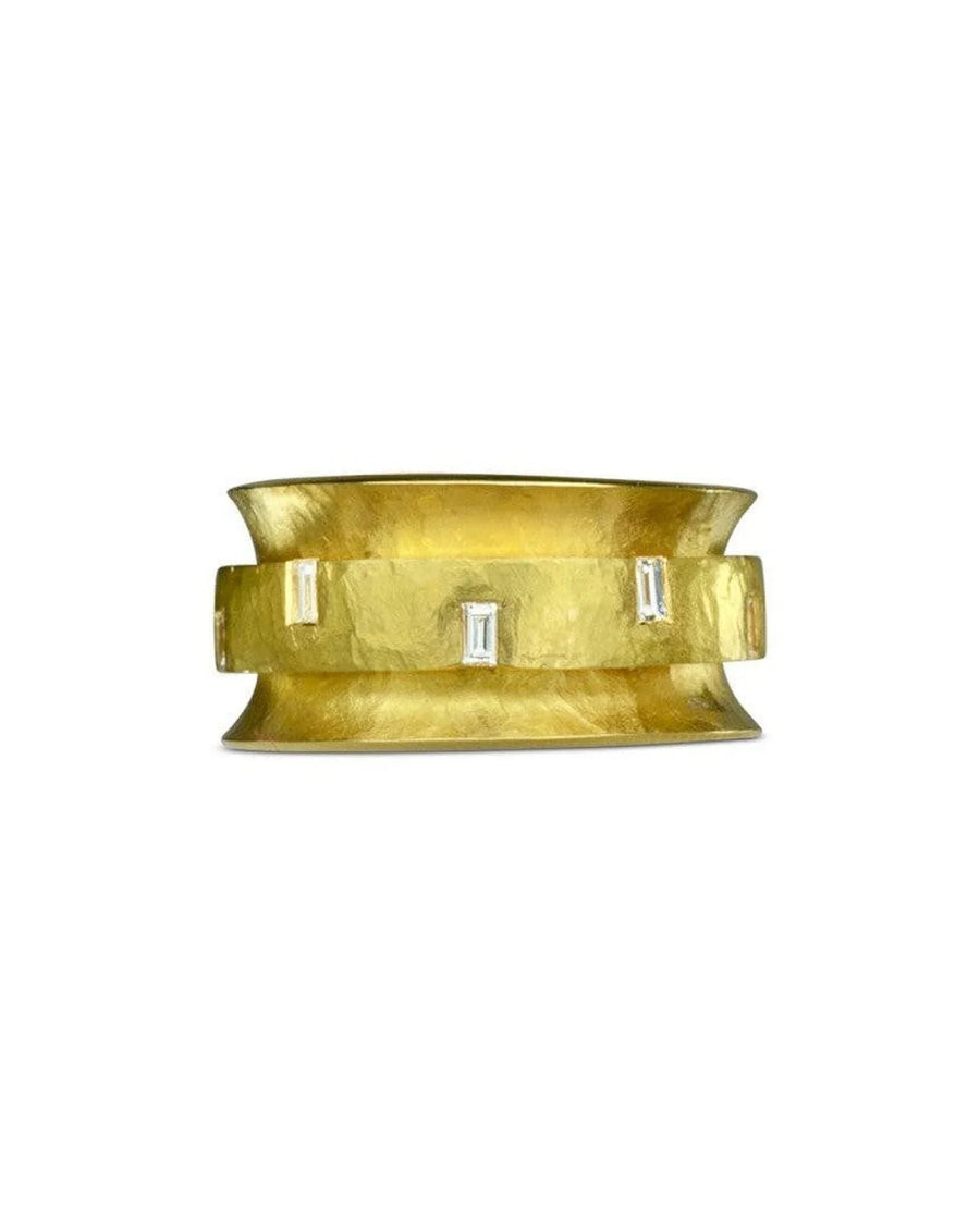Yellow gold eternity ring with baguette cut diamonds.