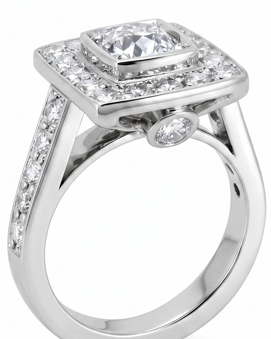 White gold square cluster engagement ring with diamond shoulders.