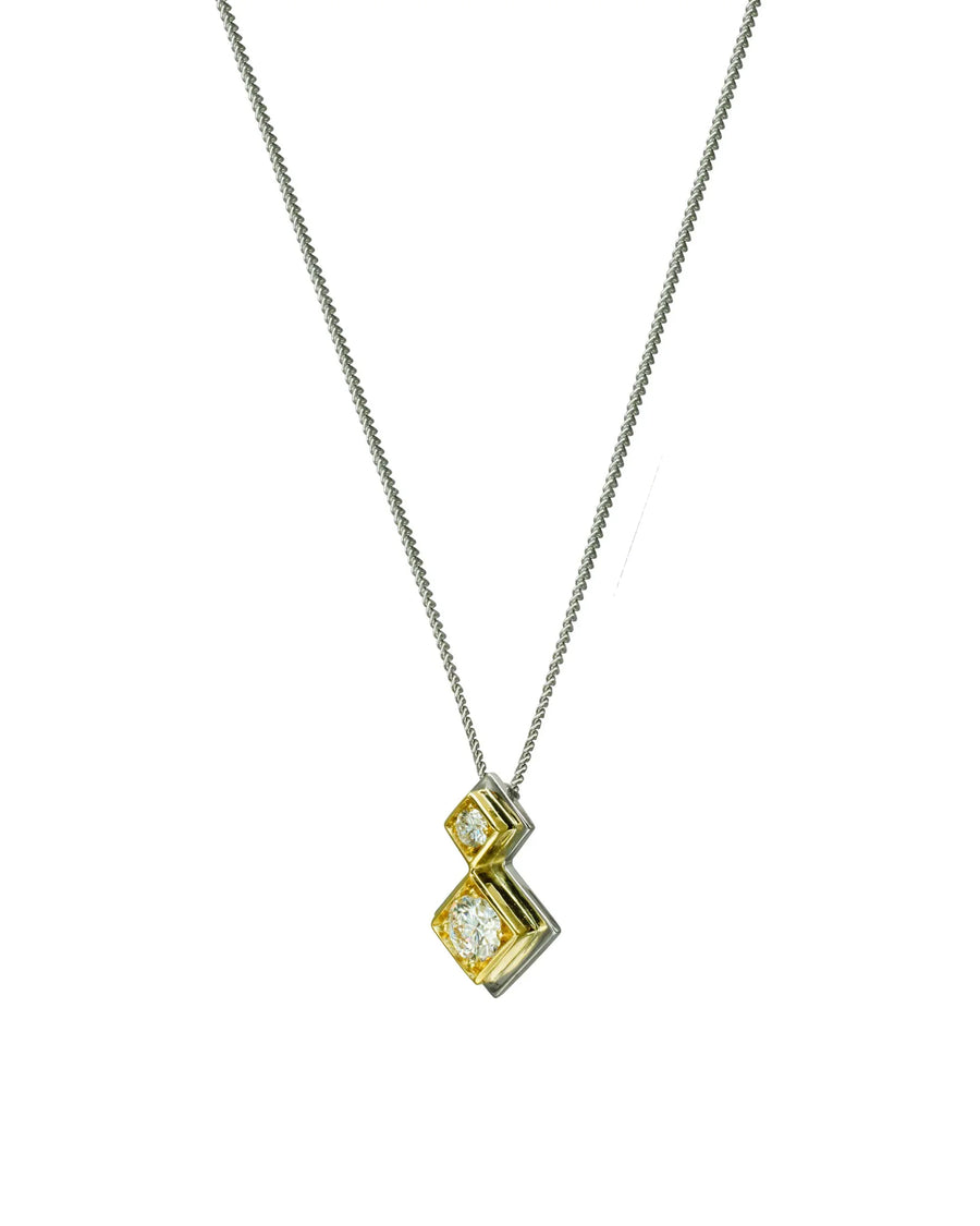 Double diamond pendant necklace with gold geometric setting on a silver chain
