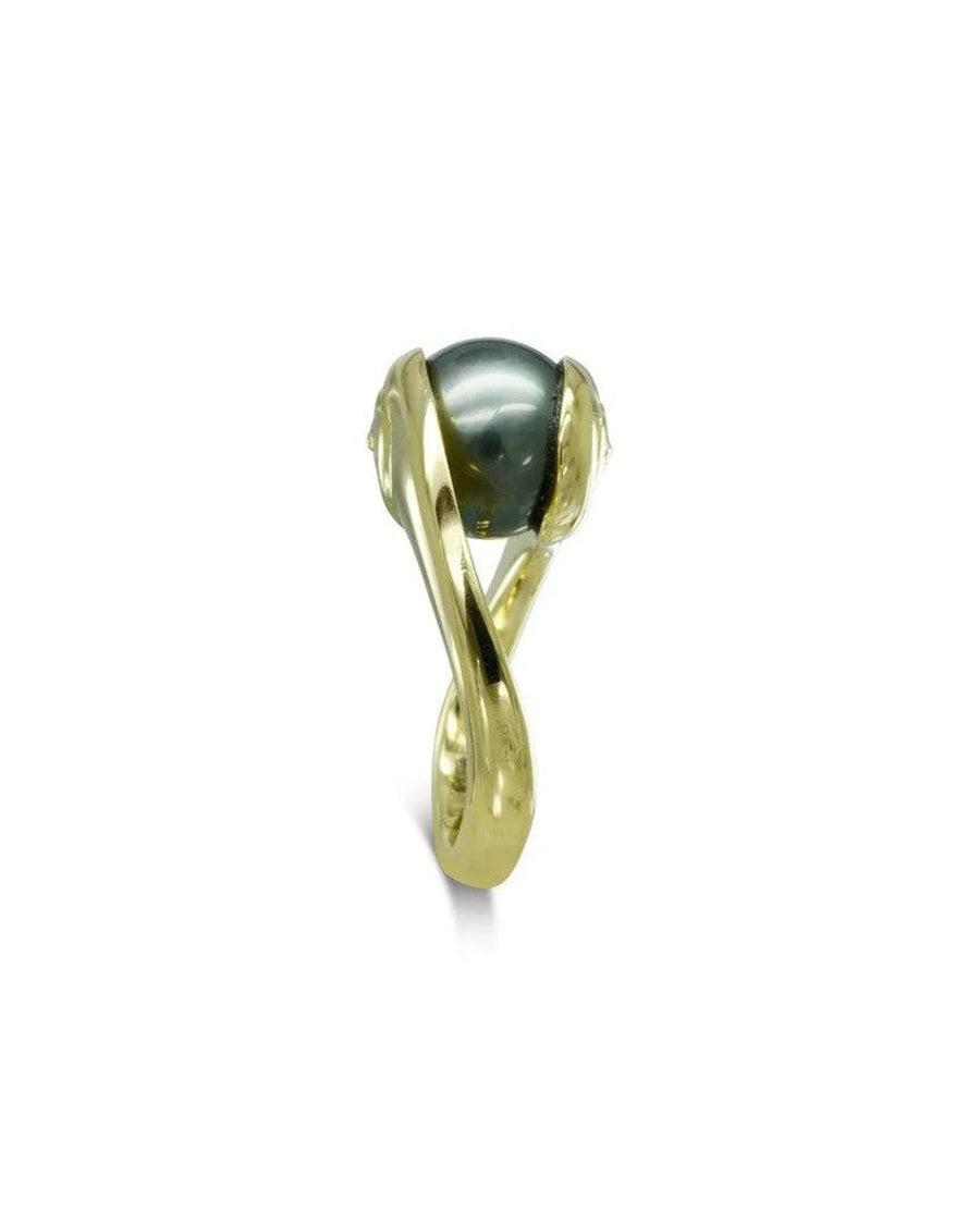 Yellow gold ring with a Tahitian pearl in a twisted organic setting on white background
