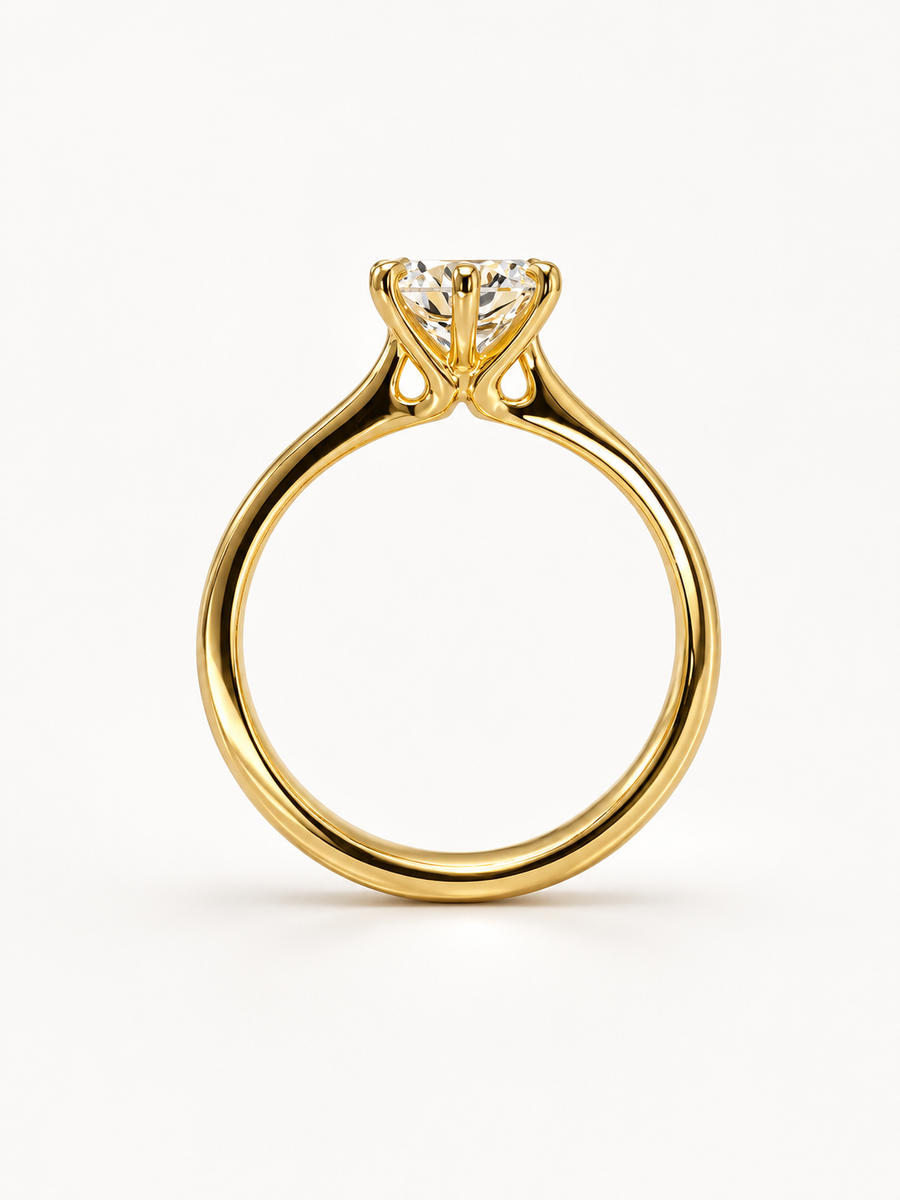 Gold Talon round cut solitaire engagement ring with a diamond.