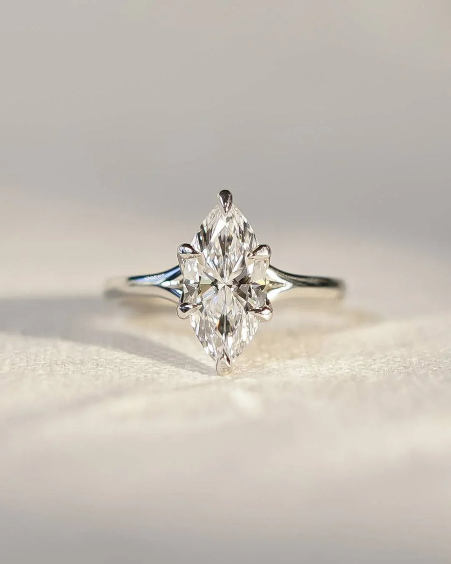 Platinum marquise cut lab-grown diamond tulip engagement ring.