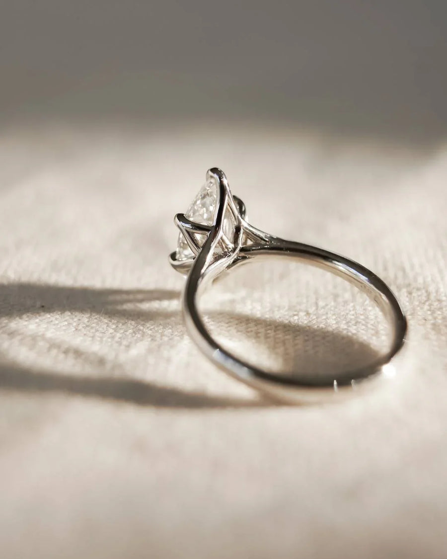 Platinum marquise cut lab-grown diamond tulip engagement ring.