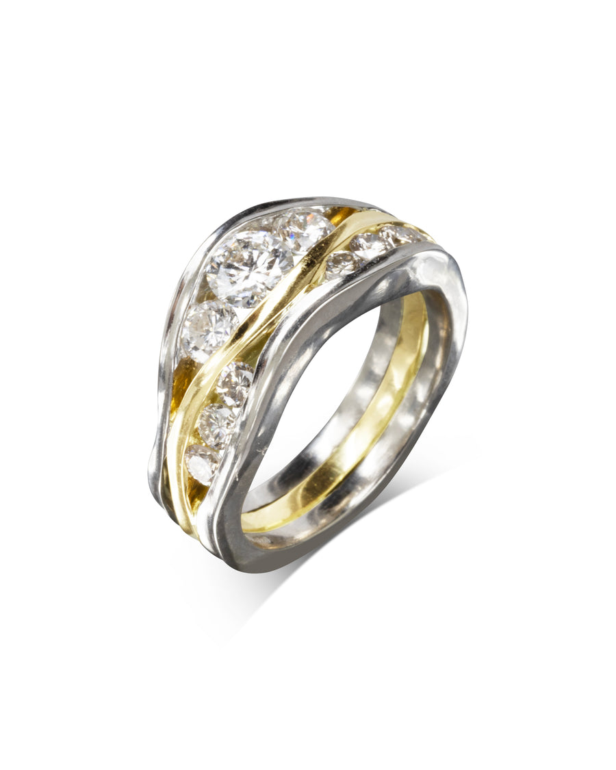 Three-band gold and silver ring with five round diamonds.