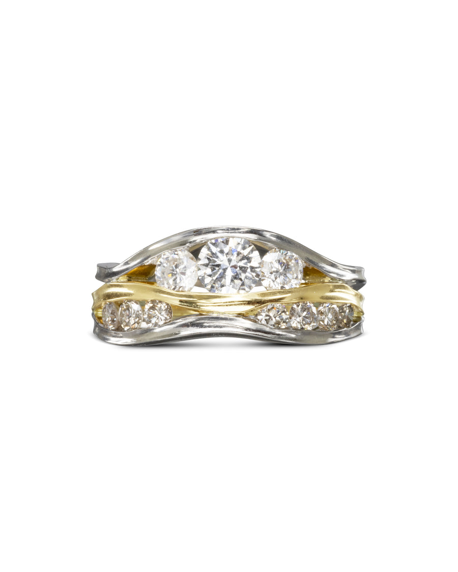 Three band diamond filled trap ring in silver and gold.