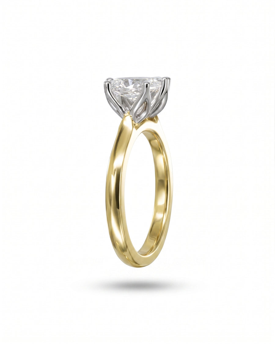 Gold and white gold Toi et Moi diamond engagement ring with claw setting.