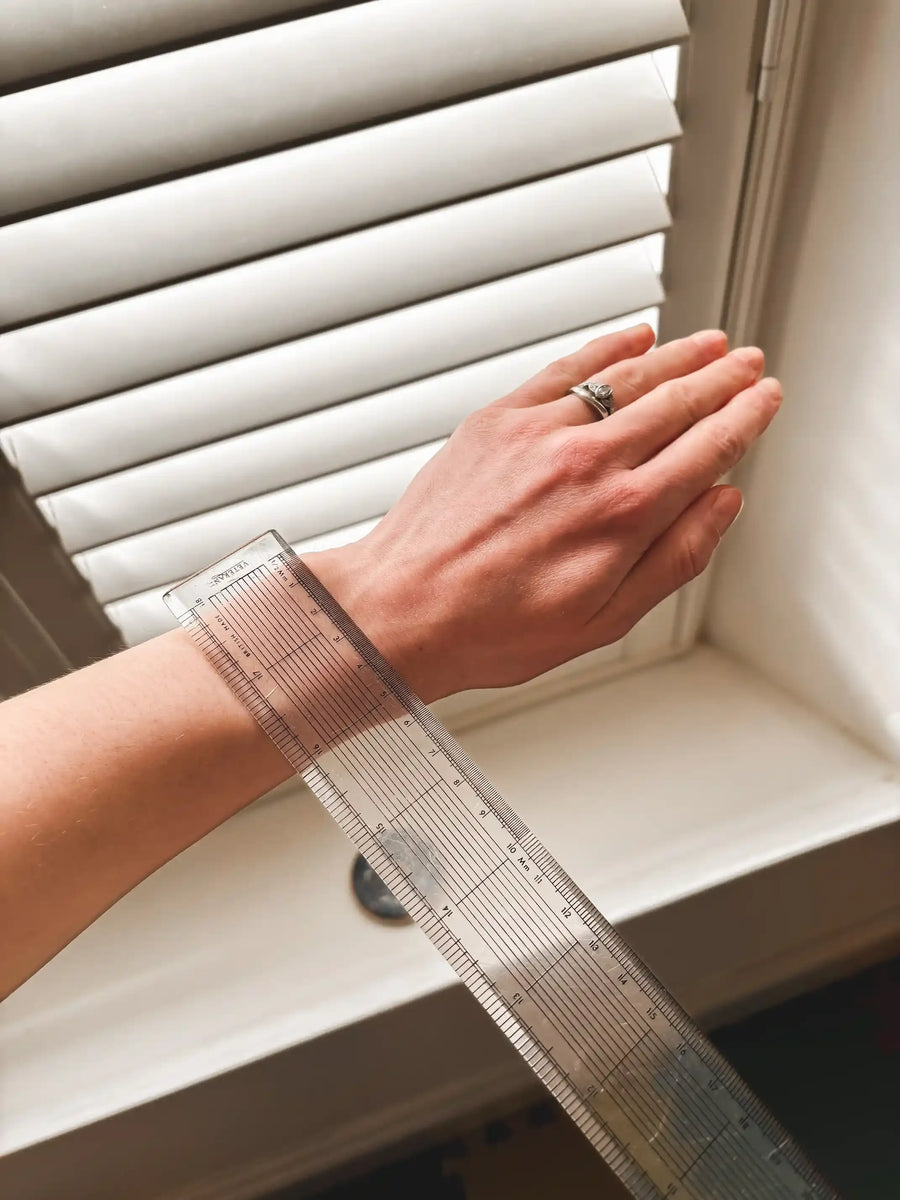 Measuring wrist size with ruler