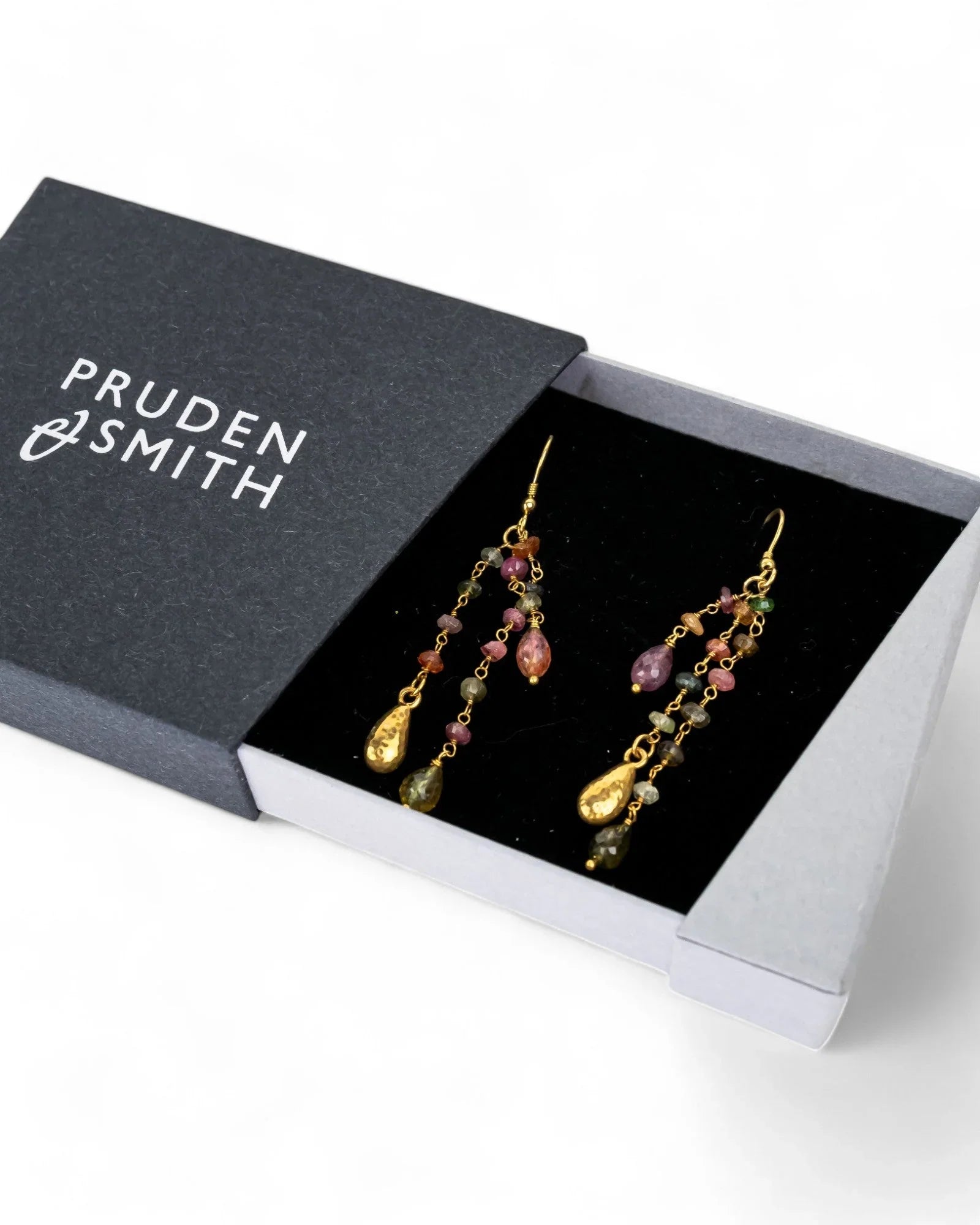 Gold drop earrings with multi-color tourmaline beads and tassels in a gift box