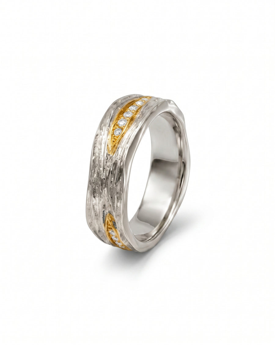 Two-colour carved ring with diamonds.
