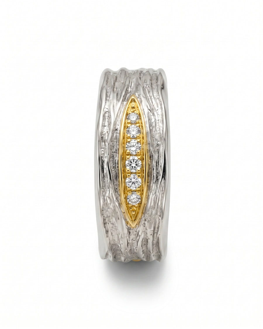 Two-tone carved ring with a gold inlay and five round diamonds.