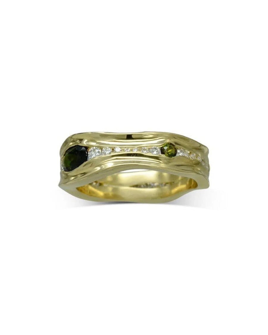 Handcrafted yellow gold ring with green tourmalines and a row of sparkling diamonds
