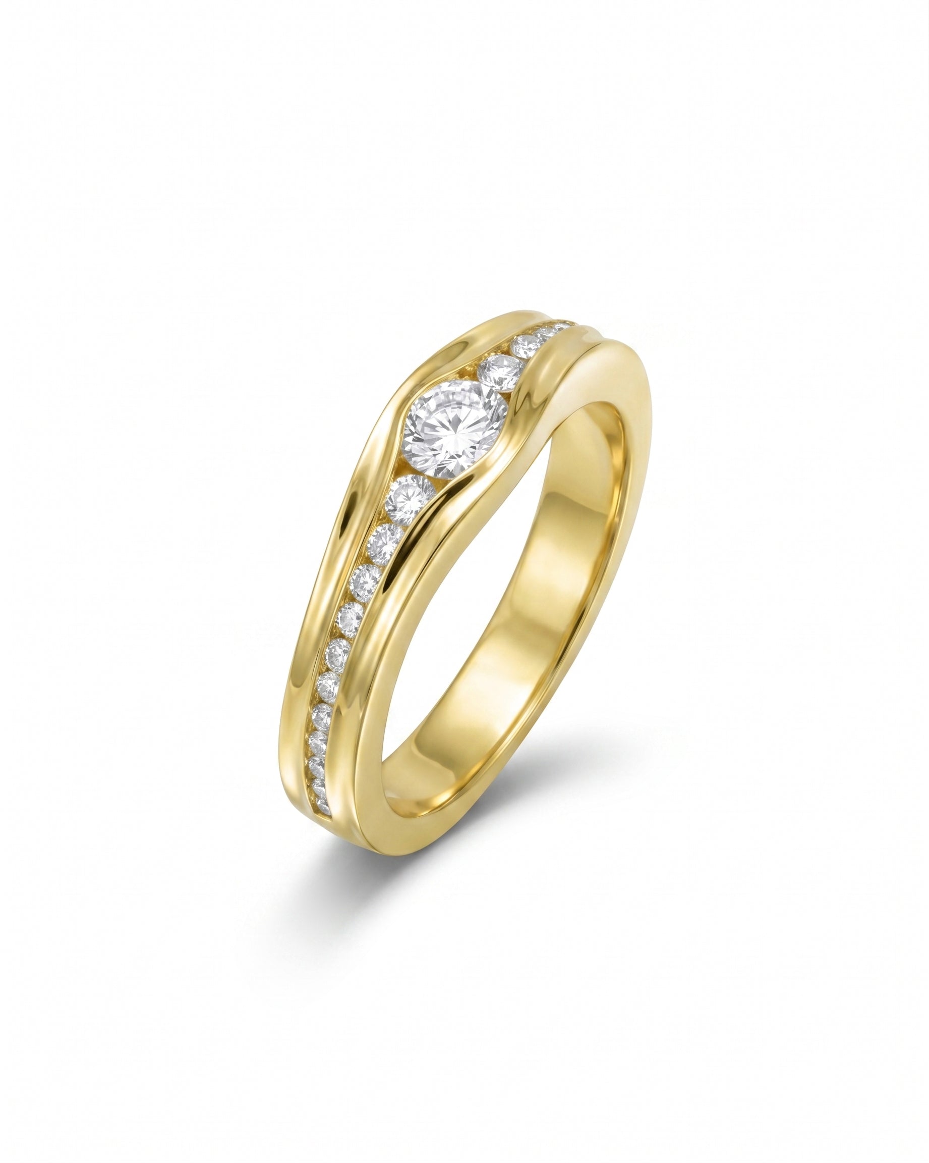 Gold engagement ring with a central round diamond and channel-set diamonds.