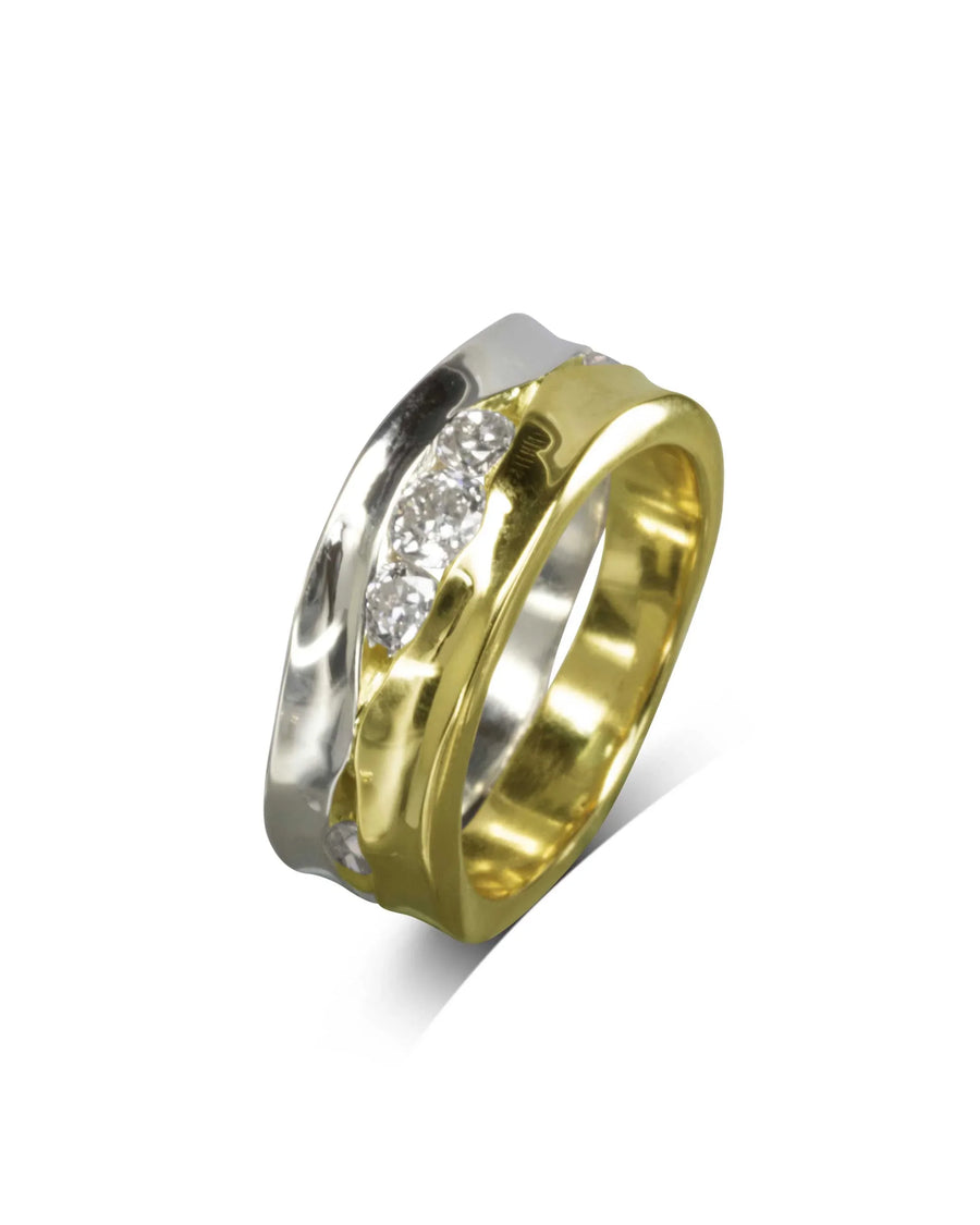 Wide two-tone gold ring with a wavy design and five trap-cut diamonds.