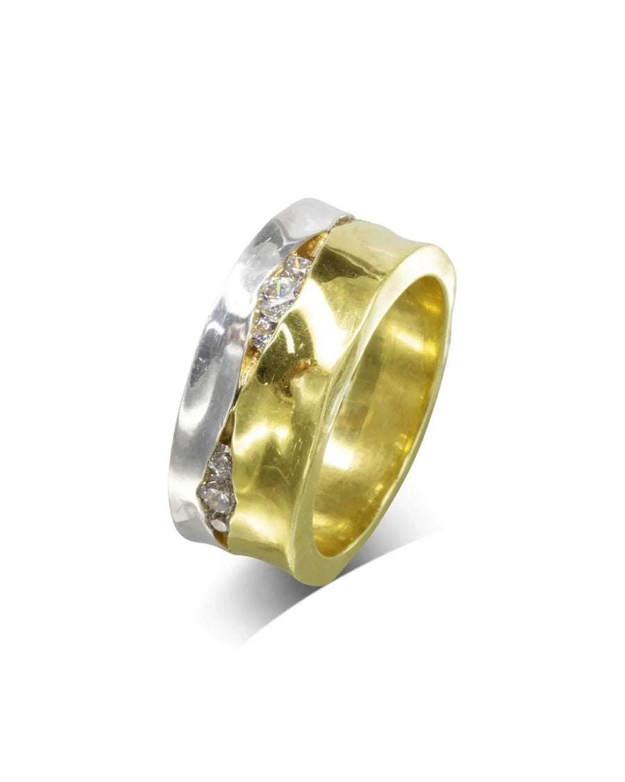 Wide two-tone gold eternity ring with trap-set diamonds.