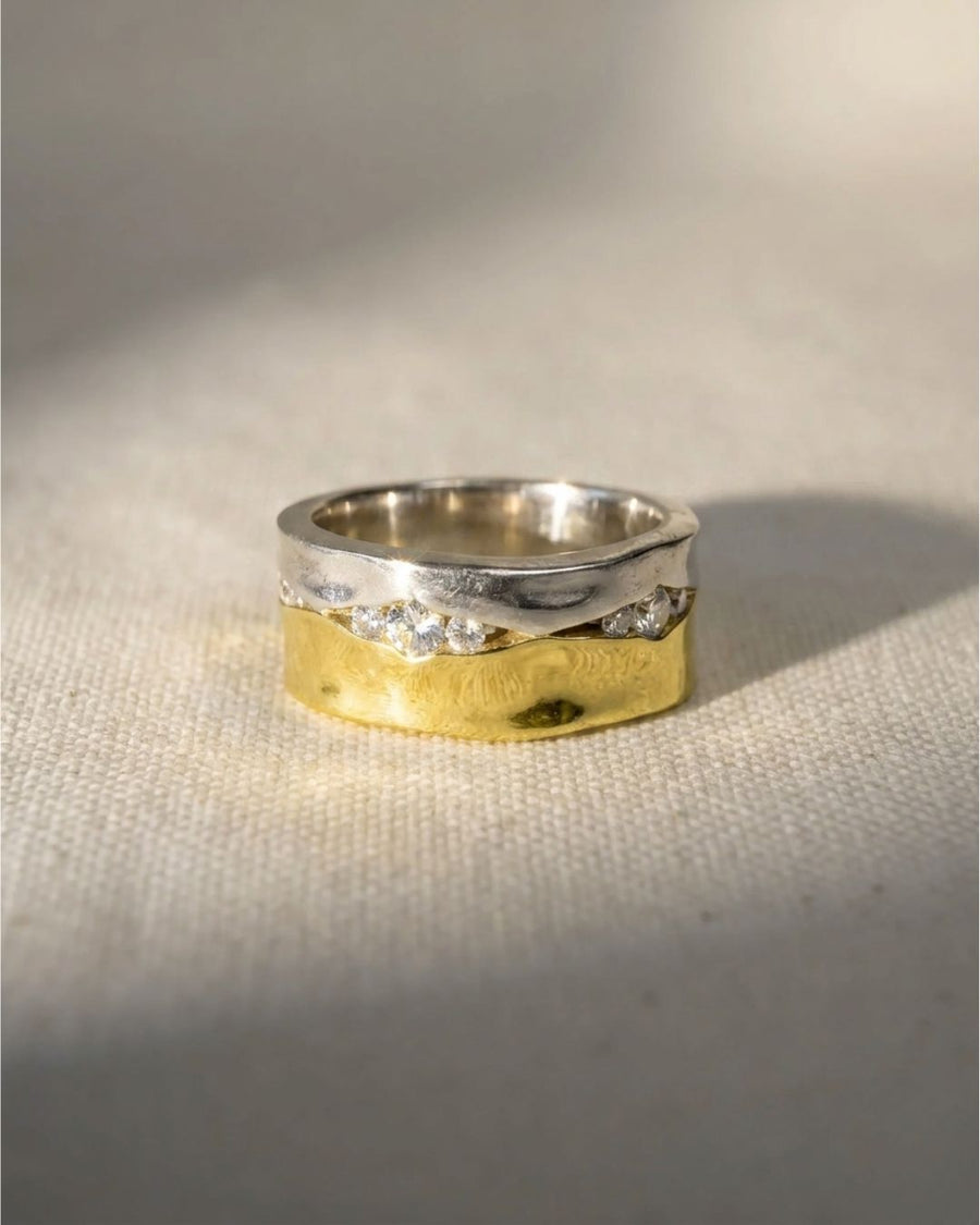 9ct white and yellow gold wide eternity ring with trap diamonds.
