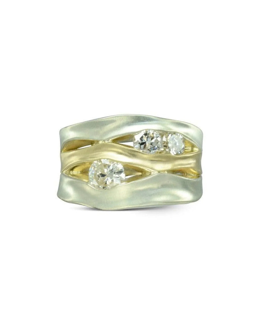 Wide mixed metal dress ring featuring organic gold and silver bands with three diamonds