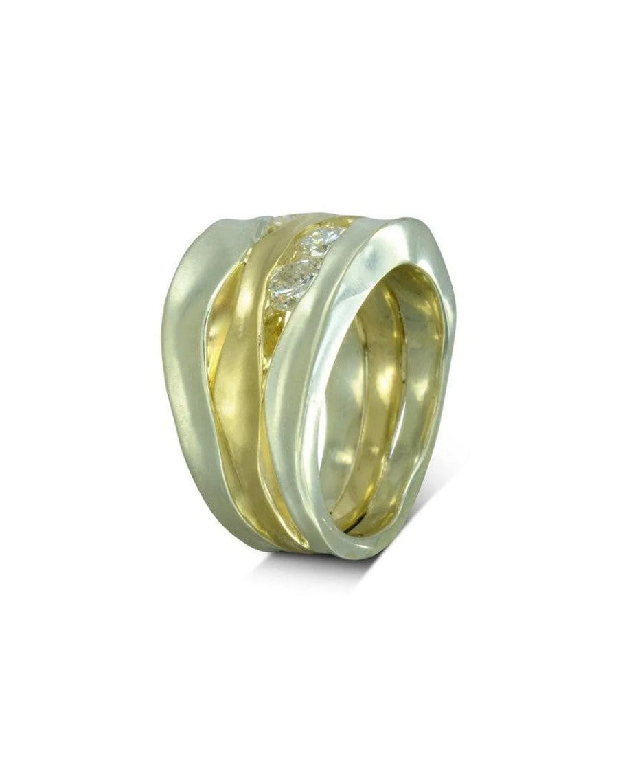 Wide mixed metal dress ring with organic gold and silver bands, set with a central diamond.