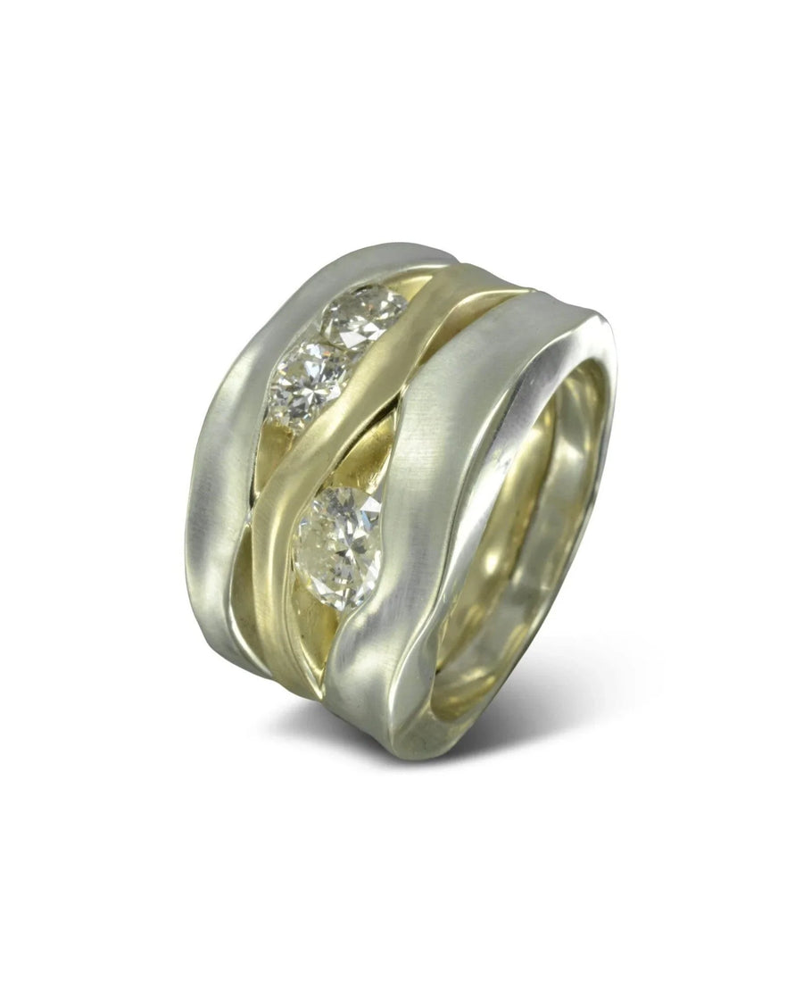 Wide mixed metal ring with organic waves and three round diamonds set in the band