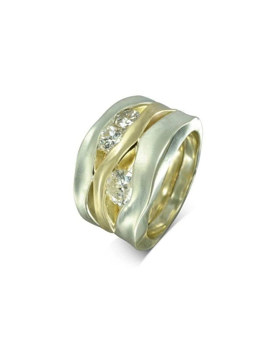 wide mixed metal ring with organic textured bands and three round diamonds
