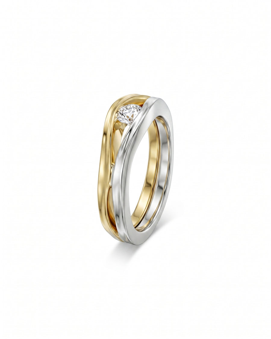 Two-tone gold solitaire engagement ring with a round diamond.