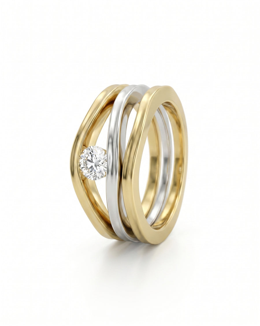 Yellow and white gold trap diamond solitaire engagement ring and wedding band set.