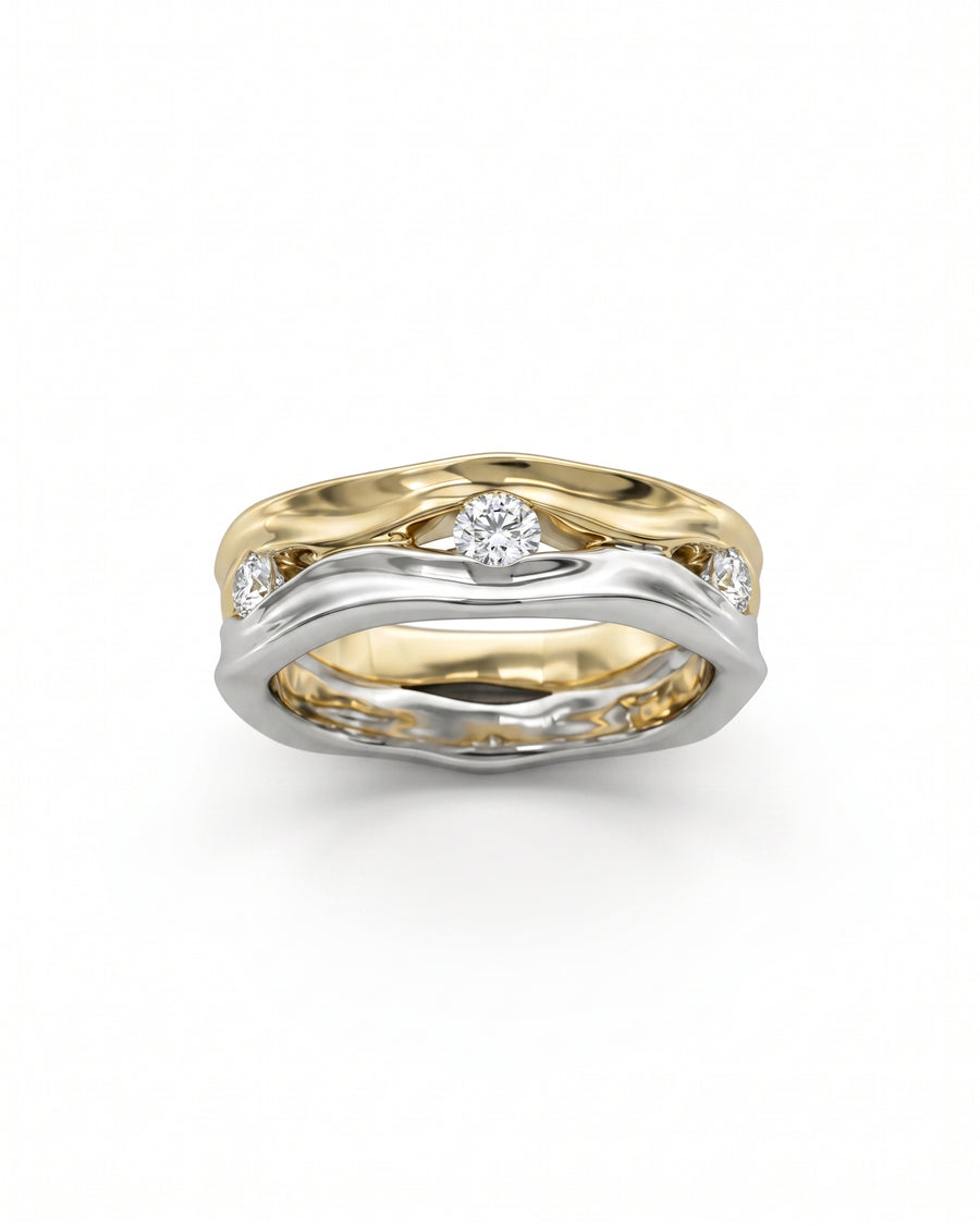 Two-tone gold and silver eternity ring with round diamonds.