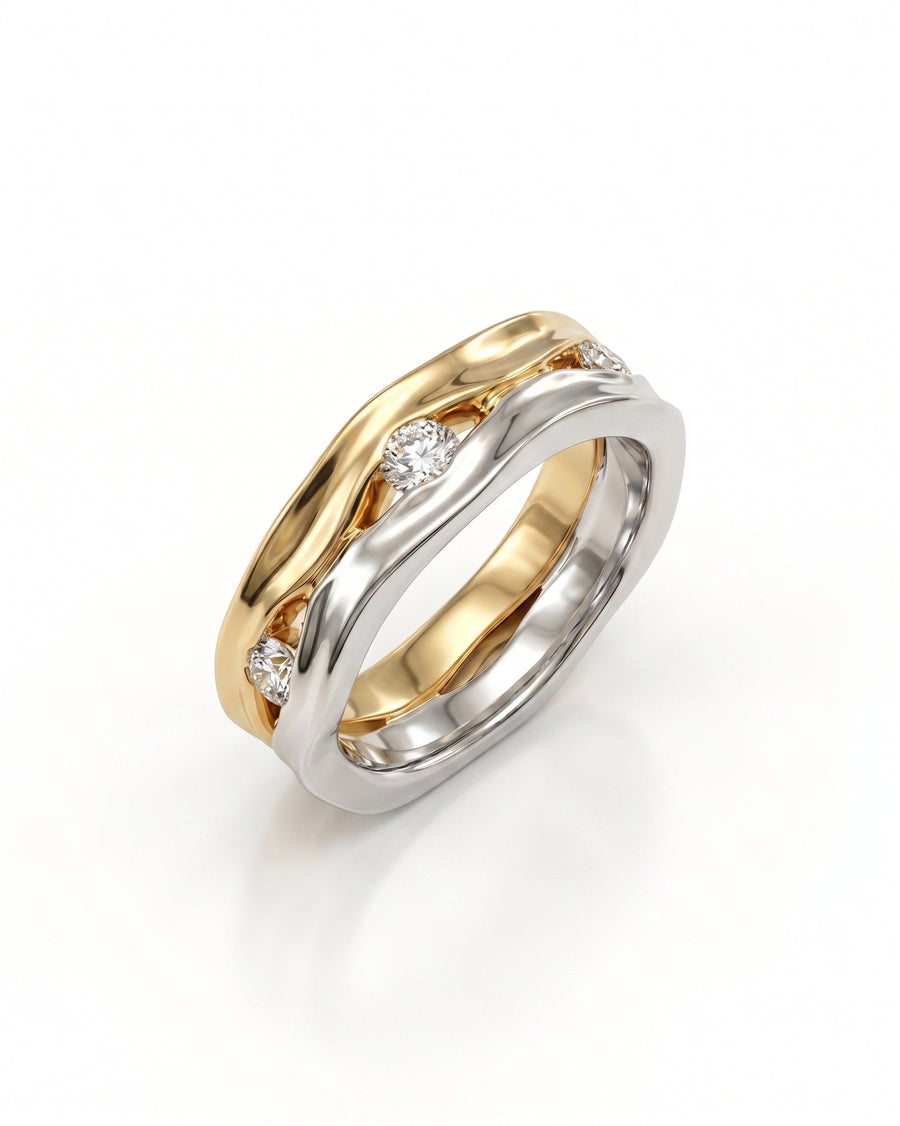 Two-tone gold and silver eternity ring with four round diamonds in a wavy design.