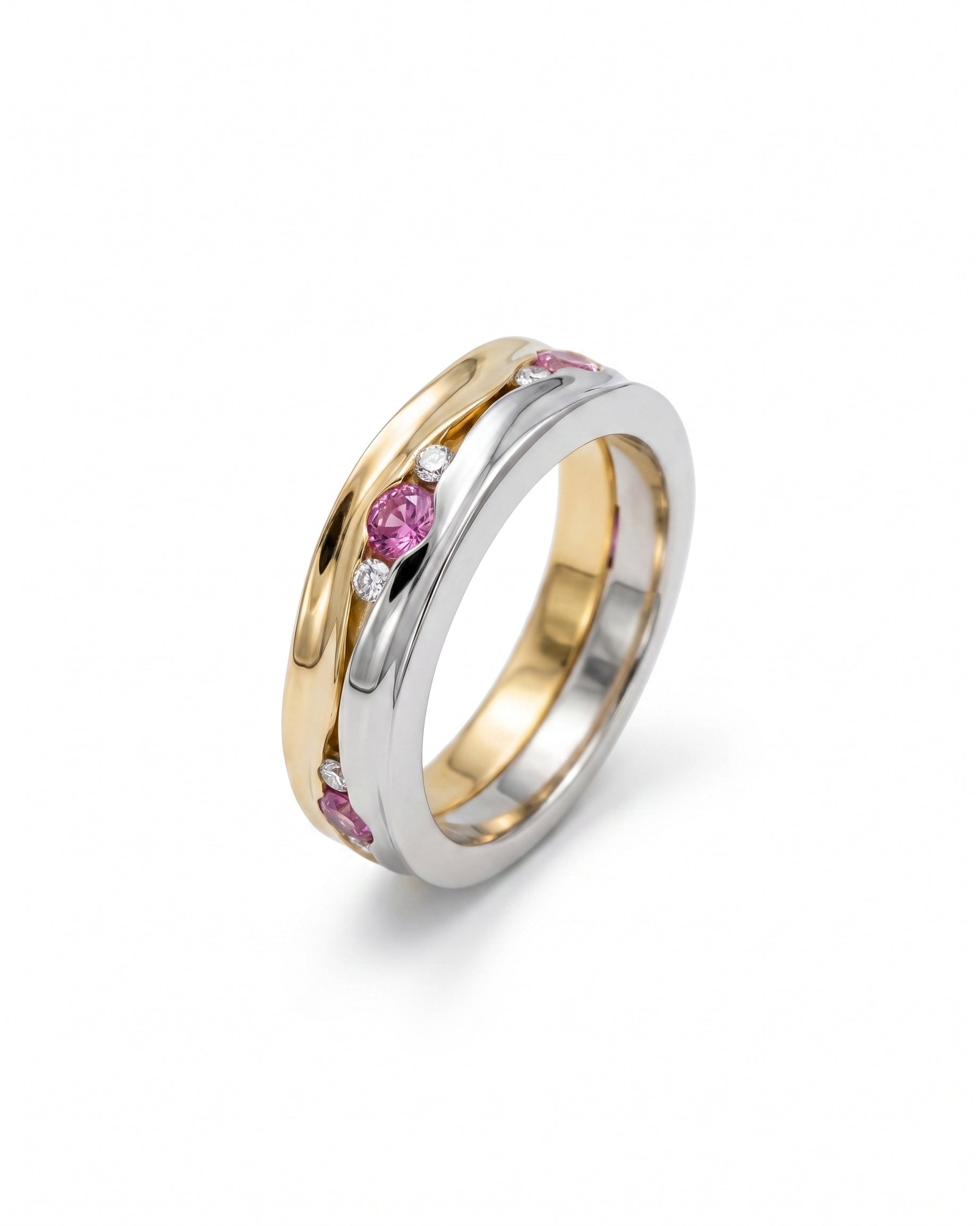Gold and silver eternity ring with pink sapphires and diamonds.