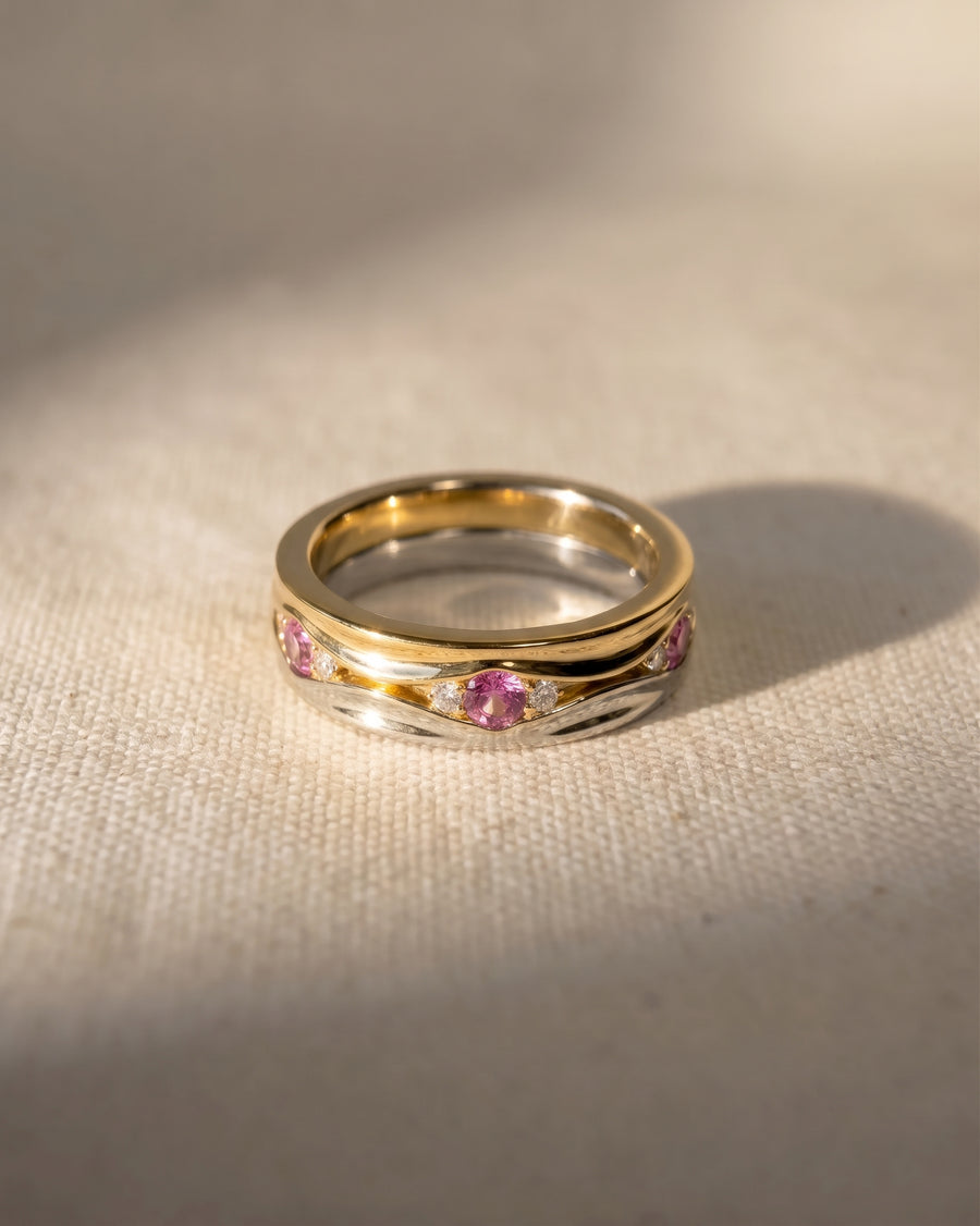 9ct white and yellow gold hammered eternity ring with pink sapphires.