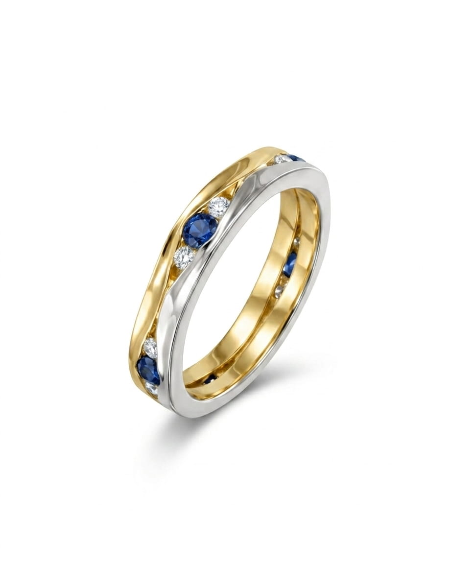 Gold and white gold eternity ring with trap sapphires and diamonds.