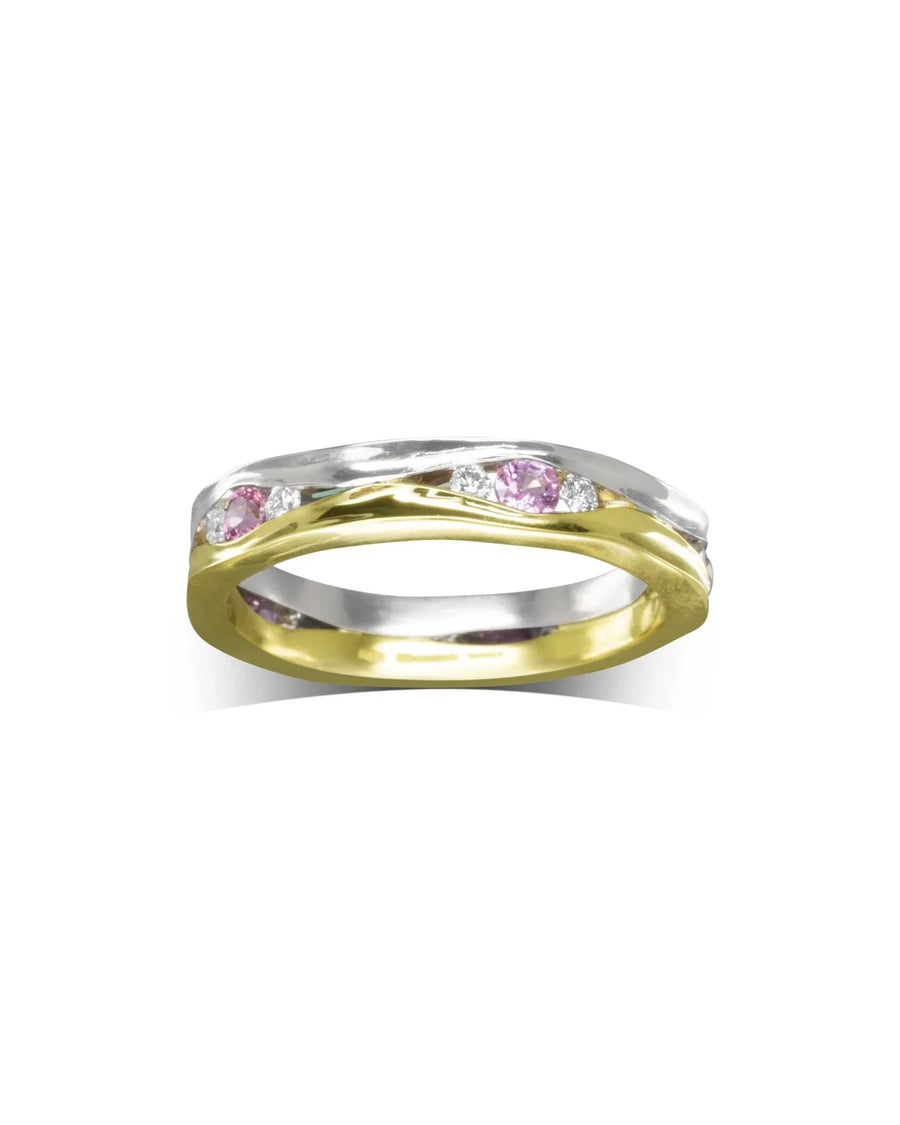 Two-tone gold eternity ring with pink sapphires and diamonds.