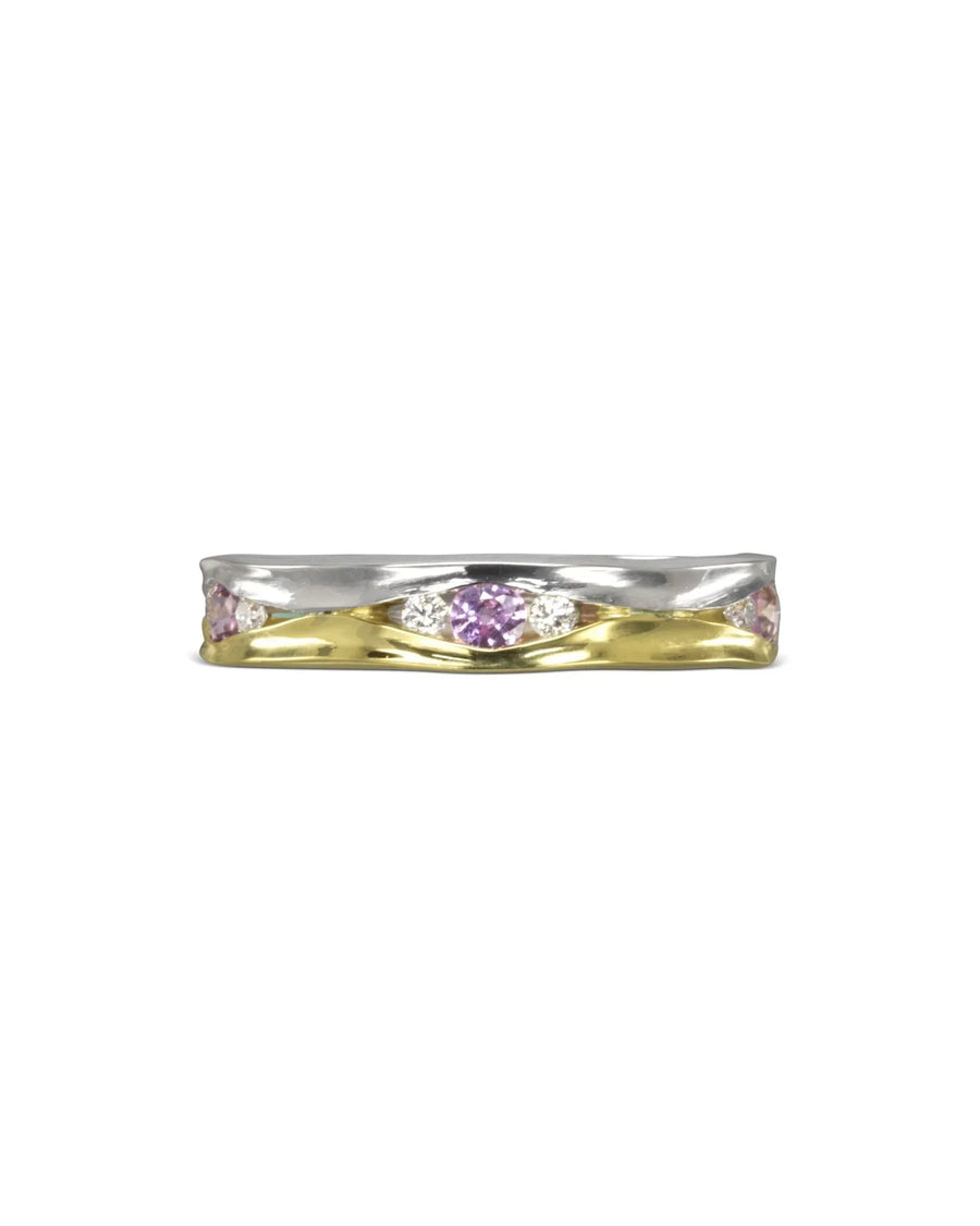 Two-tone gold eternity ring with pink sapphires and diamonds.
