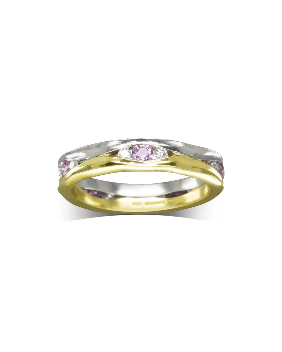 Gold and silver eternity ring with pink sapphires and diamonds.