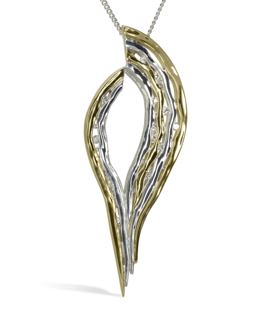 Silver and 9ct yellow gold hammered pendant with diamonds.